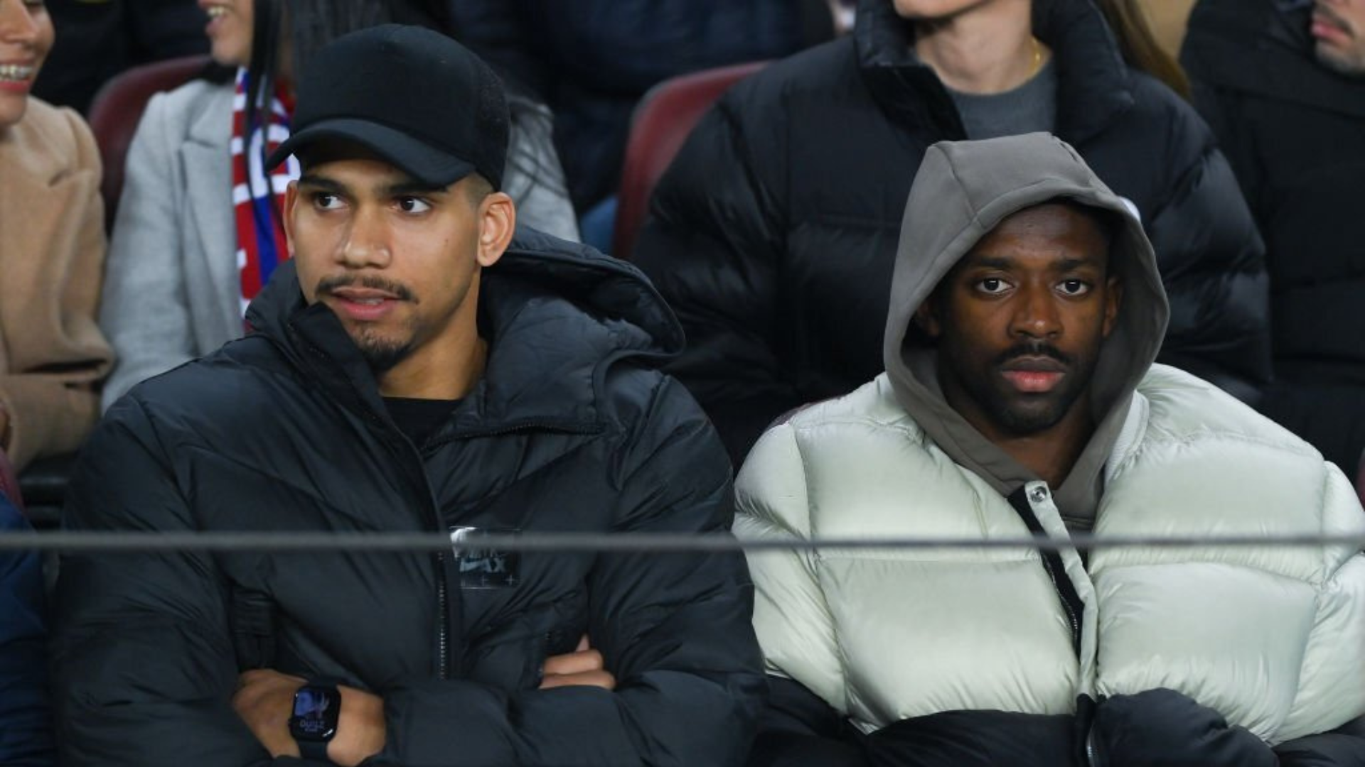 Barcelona players Dembele and Araujo in the stands