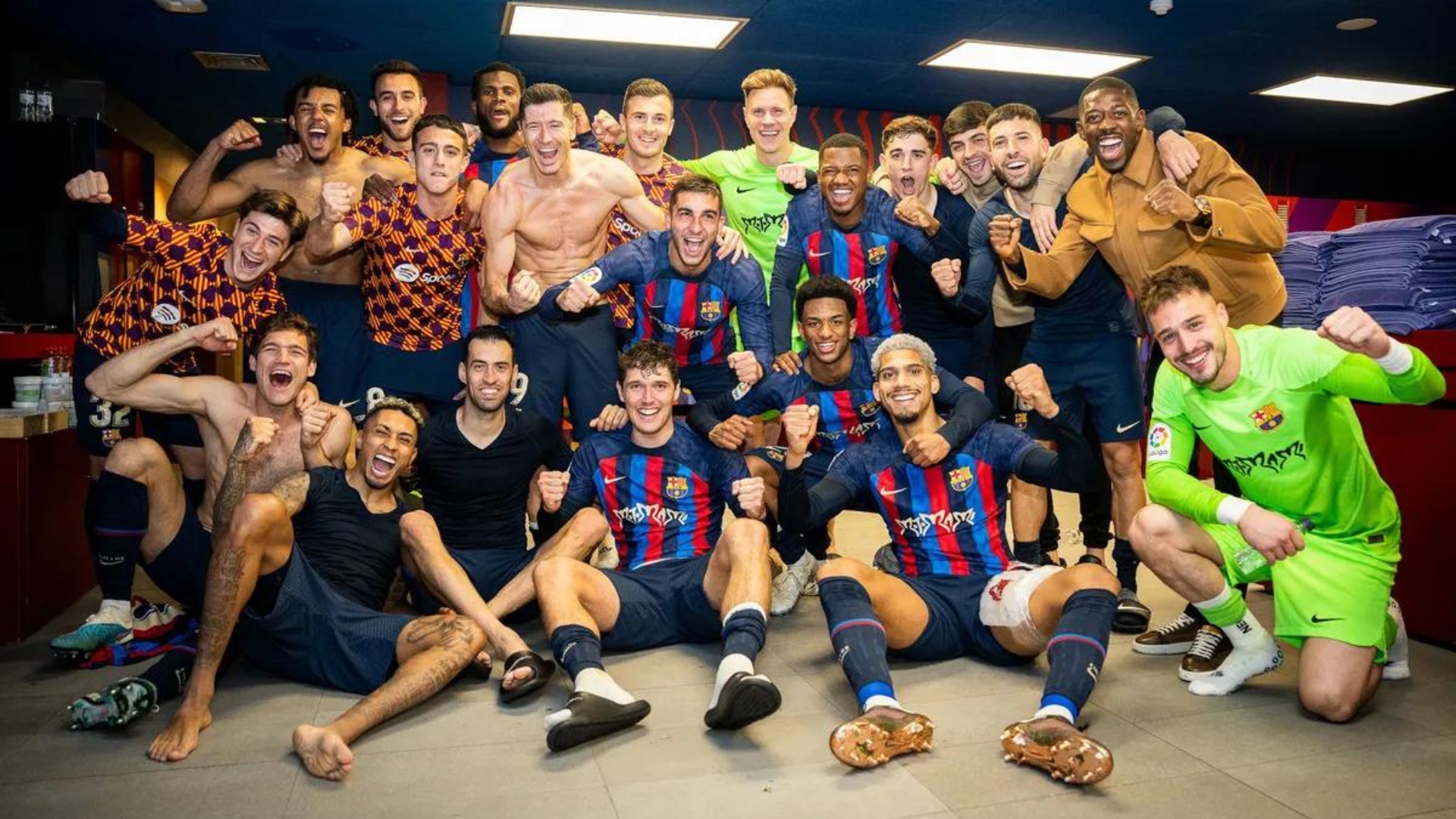 Barcelona players celebrating in the dressing room after the win against Real Madrid