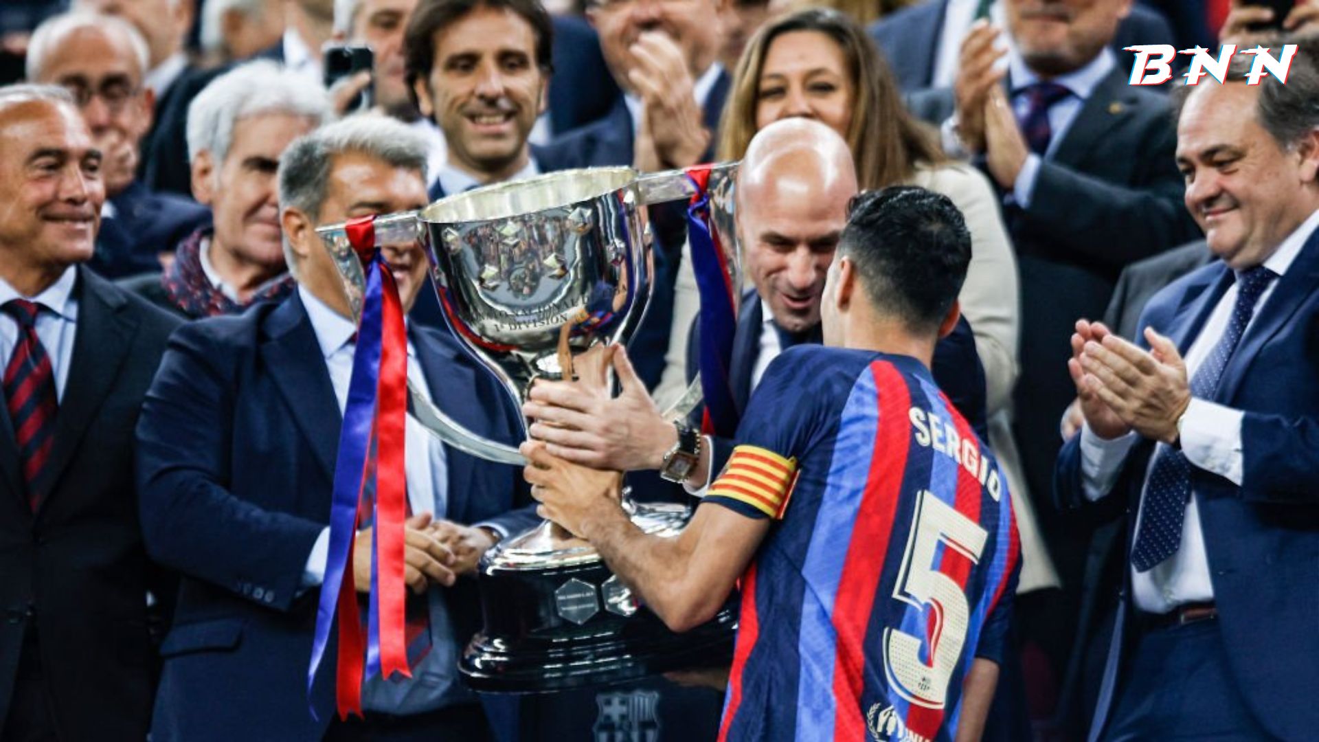 Barcelona captain Sergio Busquets lifting La Liga trophy