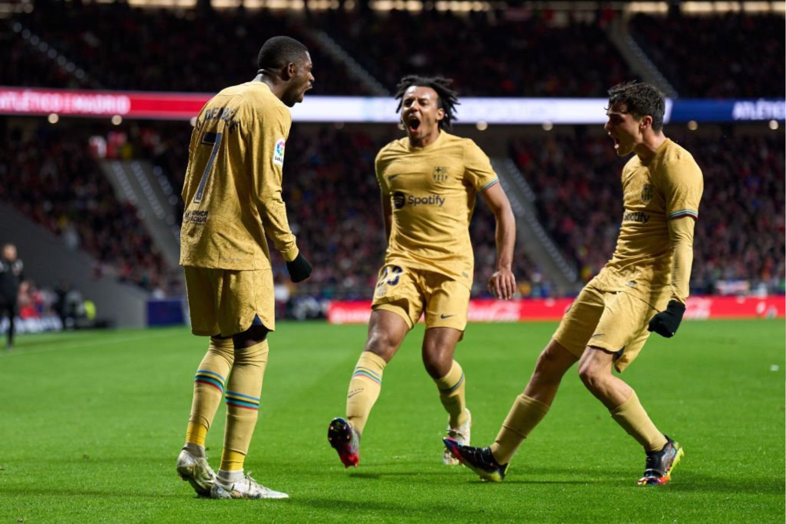 Barcelona players Dembele, Kounde and Pedri celebrating a goal