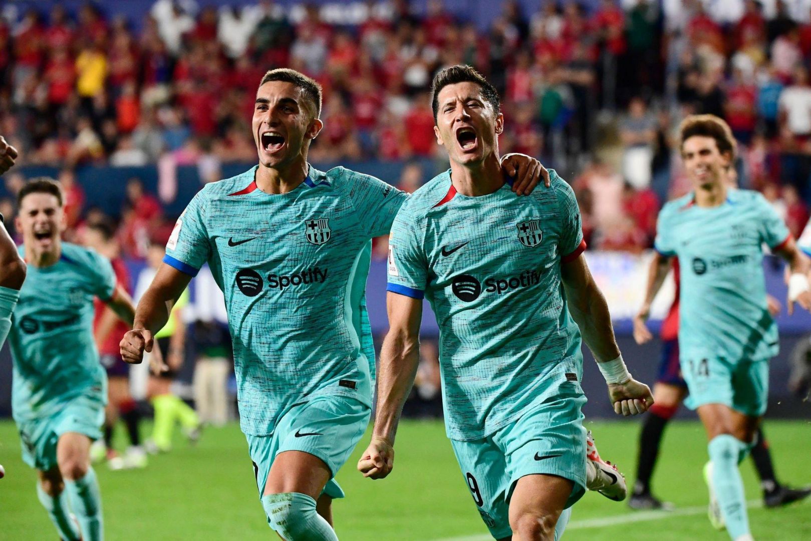 Barcelona players celebrating against CA Osasuna
