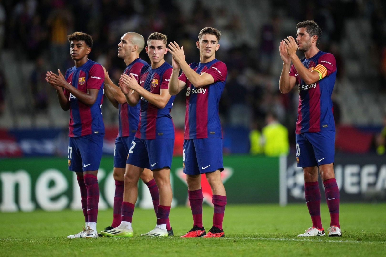 Barcelona players applauding fans