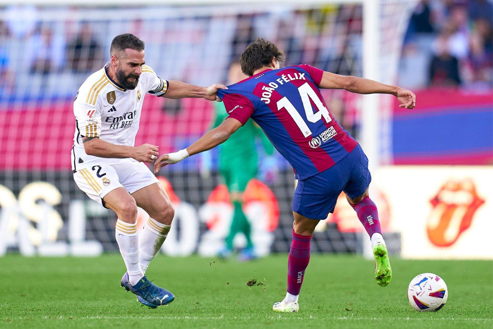 BARCELONA, SPAIN - OCTOBER 28: Joao Felix of FC Barcelona competes for the ball with Daniel Carvajal of Real Madrid during the LaLiga EA Sports match between FC Barcelona and Real Madrid CF at Estadi Olimpic Lluis Companys on October 28, 2023 in Barcelona, Spain.
