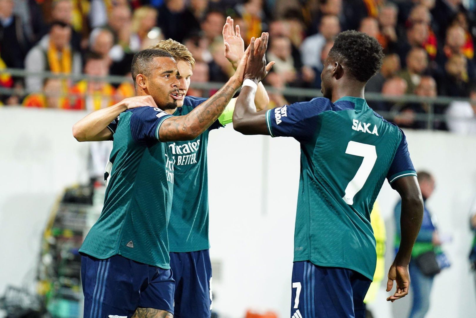 Arsenal's Gabriel Jesus celebrates scoring their side's first goal of the game with team-mates Martin Odegaard and Bukayo Saka during the UEFA Champions League Group B match at the Stade Bollaert-Delelis, Lens. Picture date: Tuesday October 3, 2023.