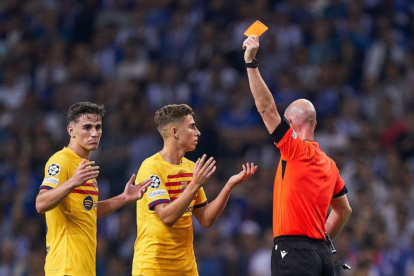 Referee, Anthony Taylor shows a red card to Gavi of FC Barcelona
