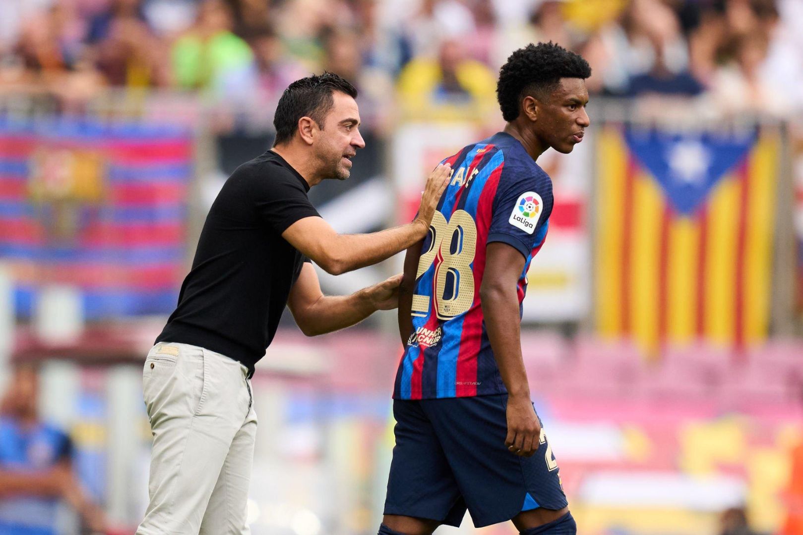 Barcelona head coach Xavi with Balde