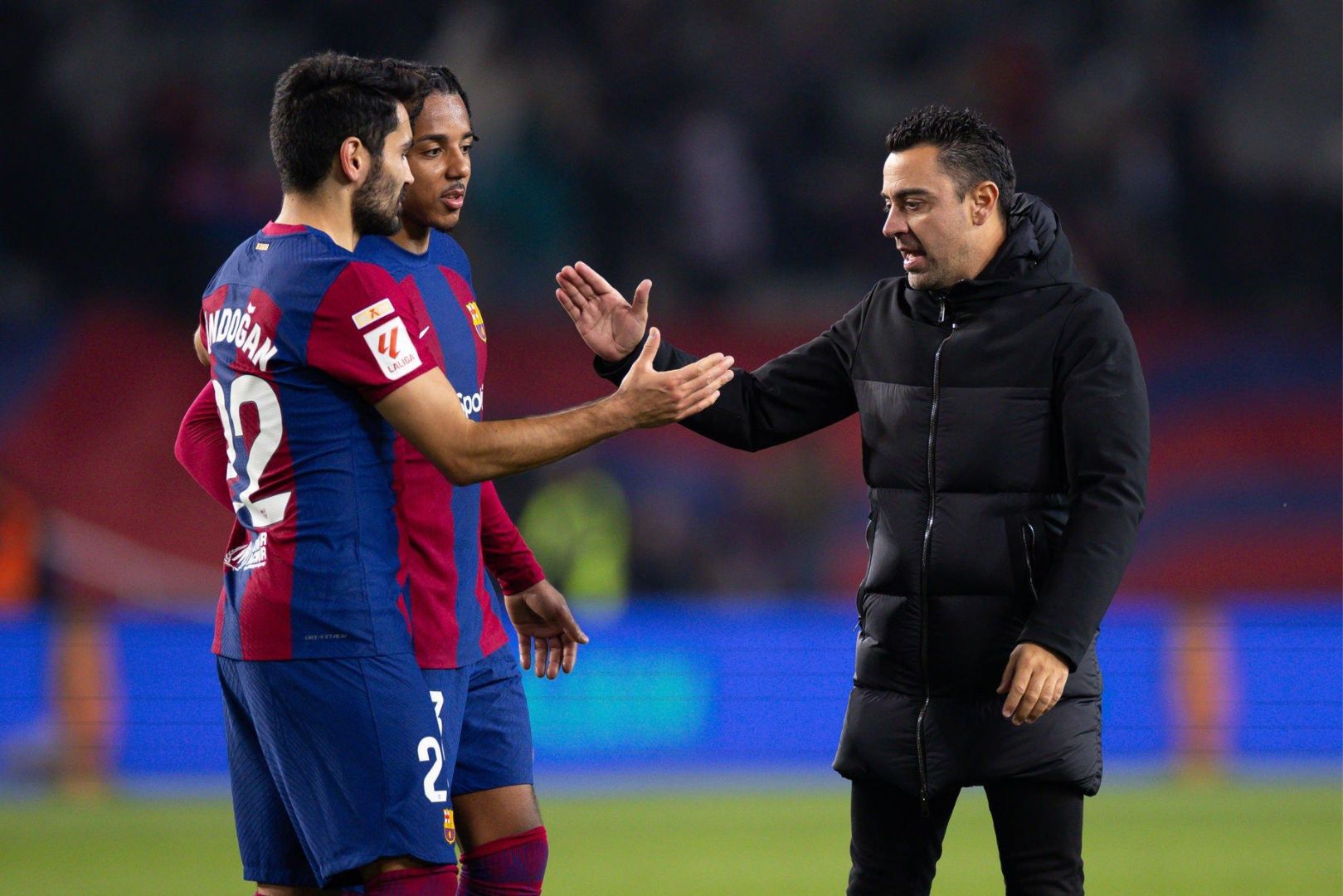 BARCELONA, SPAIN - DEC 3: Xavi Hernandez of FC Barcelona (R) during the Spanish 