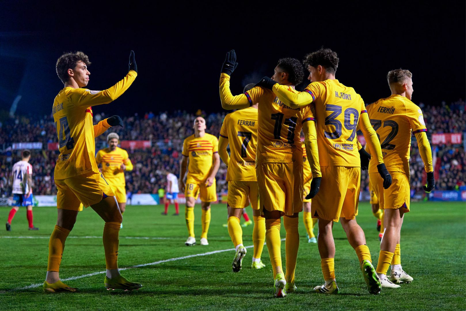 BARBASTRO, SPAIN - JANUARY 07: Players of FC Barcelona celebrating their team's second goal scored by Raphinha during the Copa del Rey round of 32 match between UD Barbastro and FC Barcelona at Campo Municipal de Deportes on January 07, 2024 in Barbastro, Spain.
