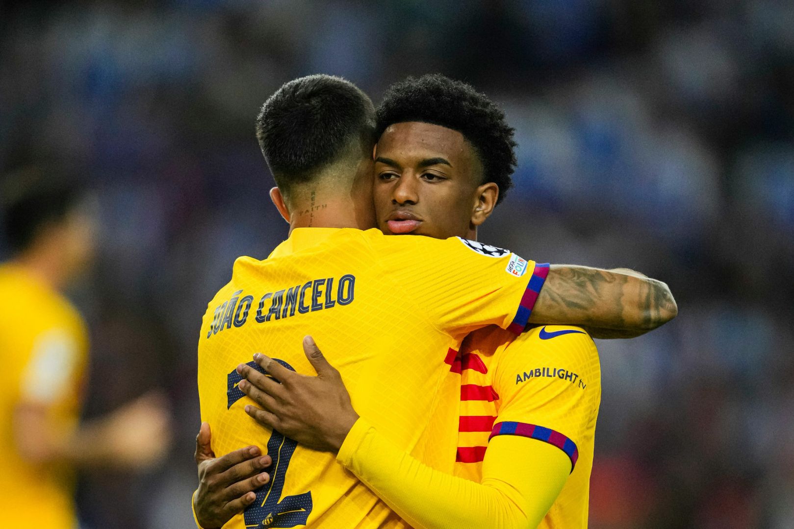 PORTO, PORTUGAL - OCTOBER 4: João Cancelo (L) high five his teammate Alejandro Balde of Barcelona (R) during the UEFA Champions League Group Stage Group H match between FC Porto and FC Barcelona at Estadio do Dragao on October 4, 2023 in Porto, Portugal.