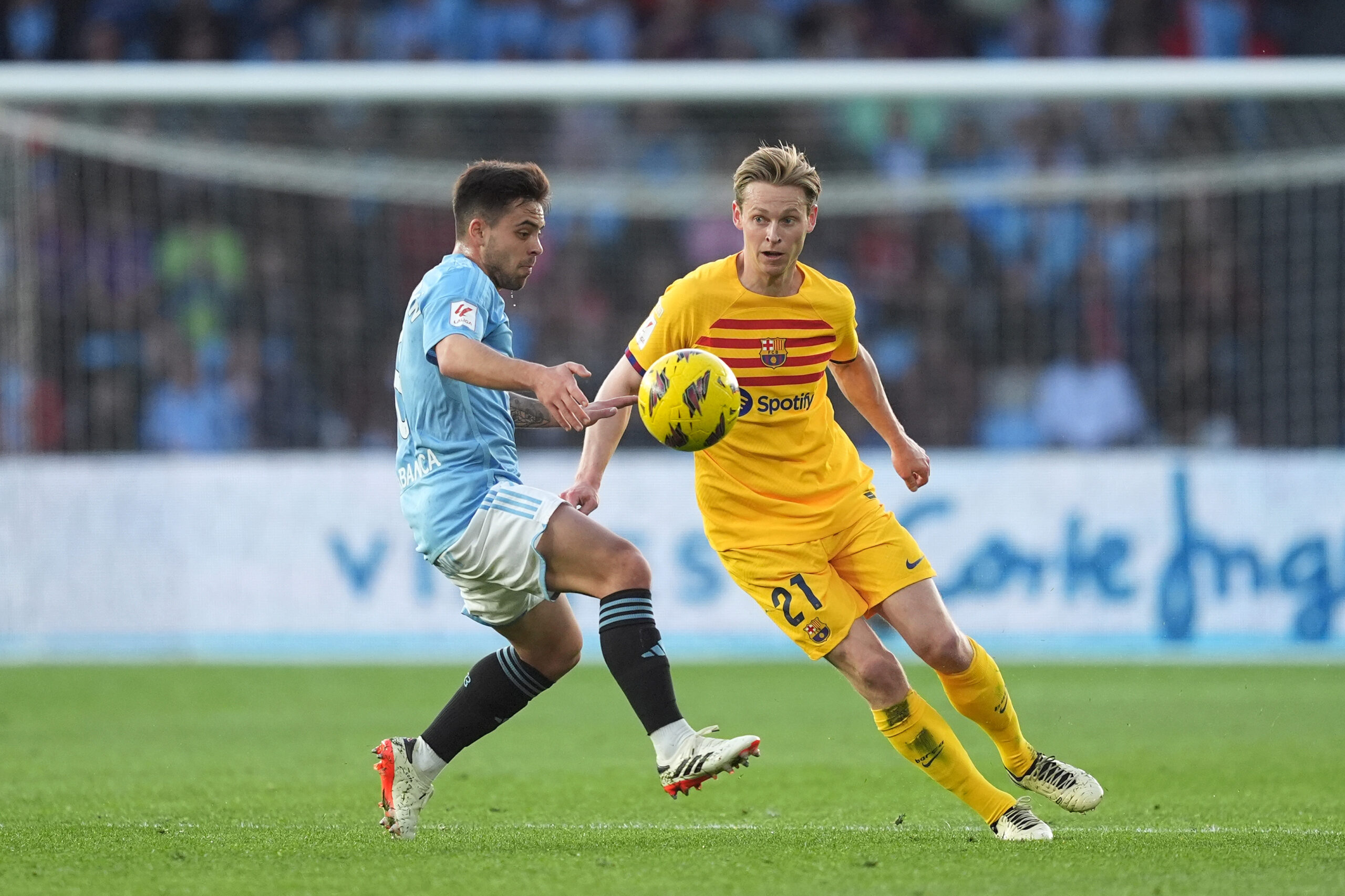 VIGO, SPAIN - FEBRUARY 17: Frenkie de Jong of FC Barcelona is challenged by Fran Beltran of Celta Vigo during the LaLiga EA Sports match between Celta Vigo and FC Barcelona at Estadio Balaidos on February 17, 2024 in Vigo, Spain.