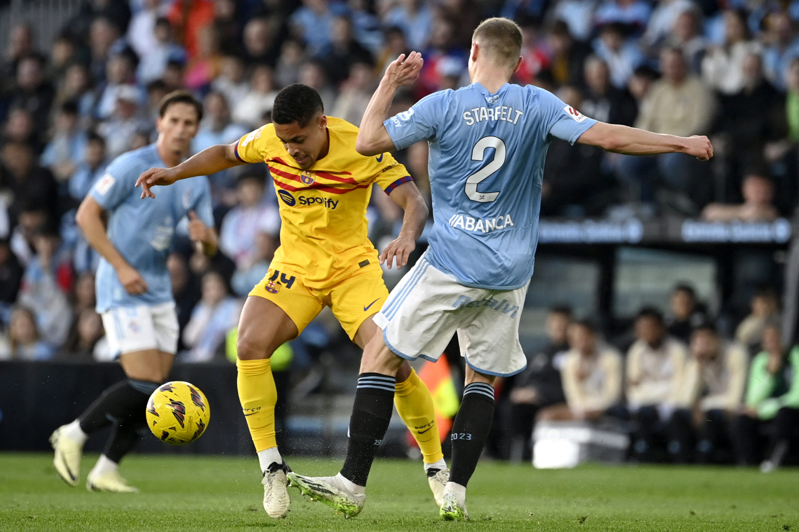 Barcelona's Brazilian forward #19 Vitor Roque vies with Celta Vigo's Swedish defender #02 Carl Starfelt during the Spanish league football match between RC Celta de Vigo and FC Barcelona at the Balaidos stadium in Vigo on February 17, 2024.