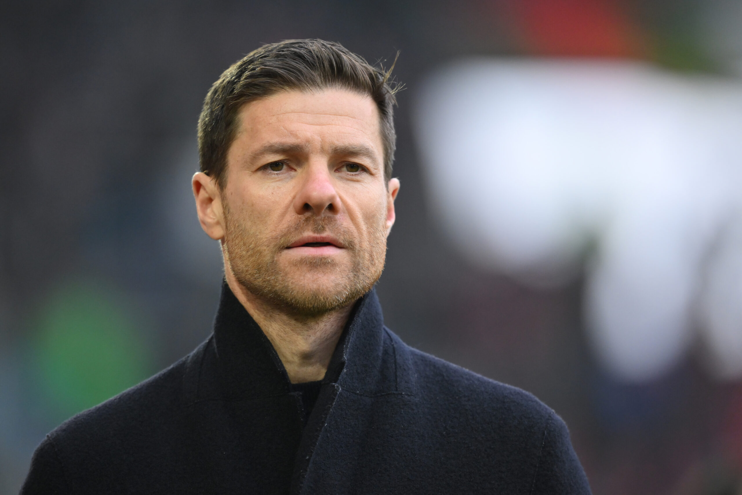 AUGSBURG, GERMANY - JANUARY 13: Head coach Xabi Alonso of Bayer 04 Leverkusen looks on prior to the Bundesliga match between FC Augsburg and Bayer 04 Leverkusen at WWK-Arena on January 13, 2024 in Augsburg, Germany.