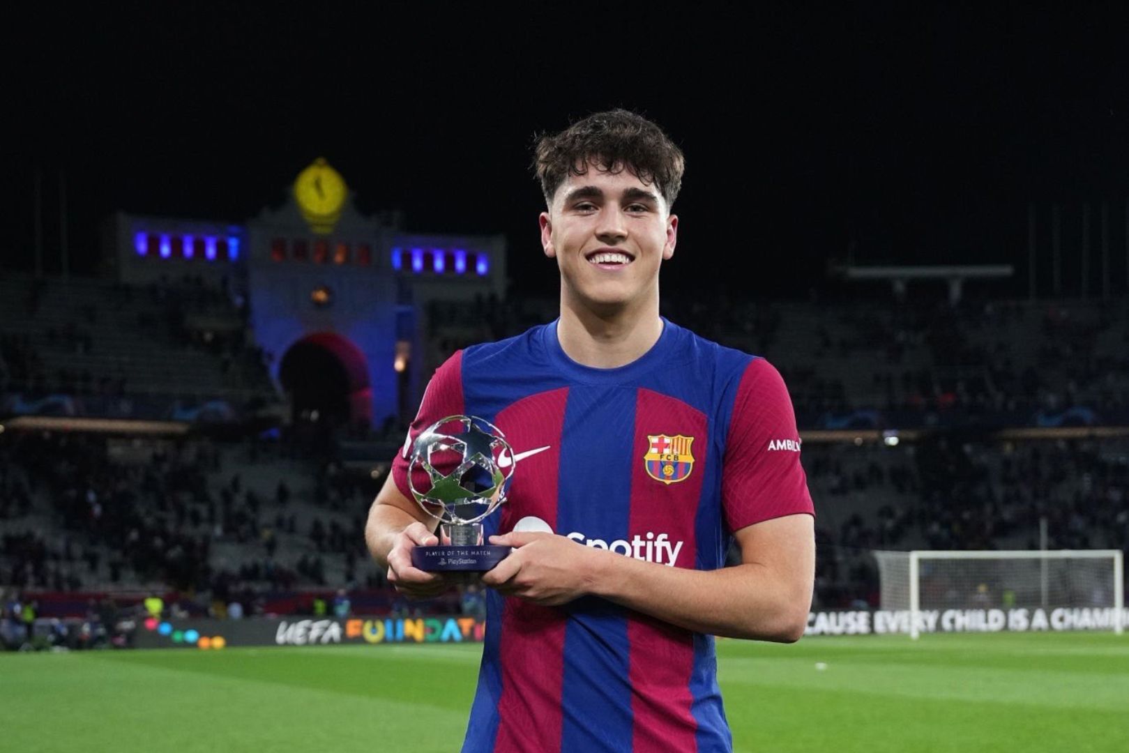 BARCELONA, SPAIN - MARCH 12: Pau Cubarsi of FC Barcelona poses for a photo after being awarded as the PlayStation Player of the Match at full-time following the team's victory in the UEFA Champions League 2023/24 round of 16 second leg match between FC Barcelona and SSC Napoli at Estadi Olimpic Lluis Companys on March 12, 2024 in Barcelona, Spain.