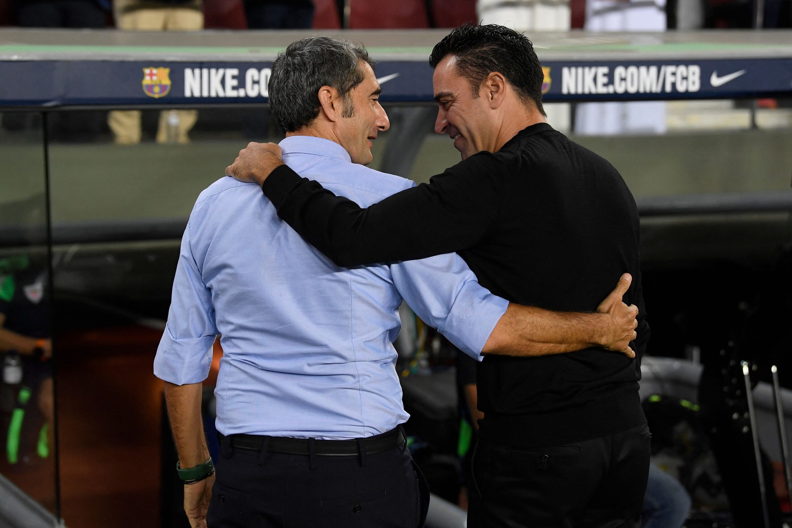 Barcelona's Spanish coach Xavi (R) and Athletic Bilbao's Spanish coach Ernesto Valverde hug prior the Spanish league football match between FC Barcelona and Athletic Club Bilbao at the Camp Nou stadium in Barcelona, on October 23, 2022.