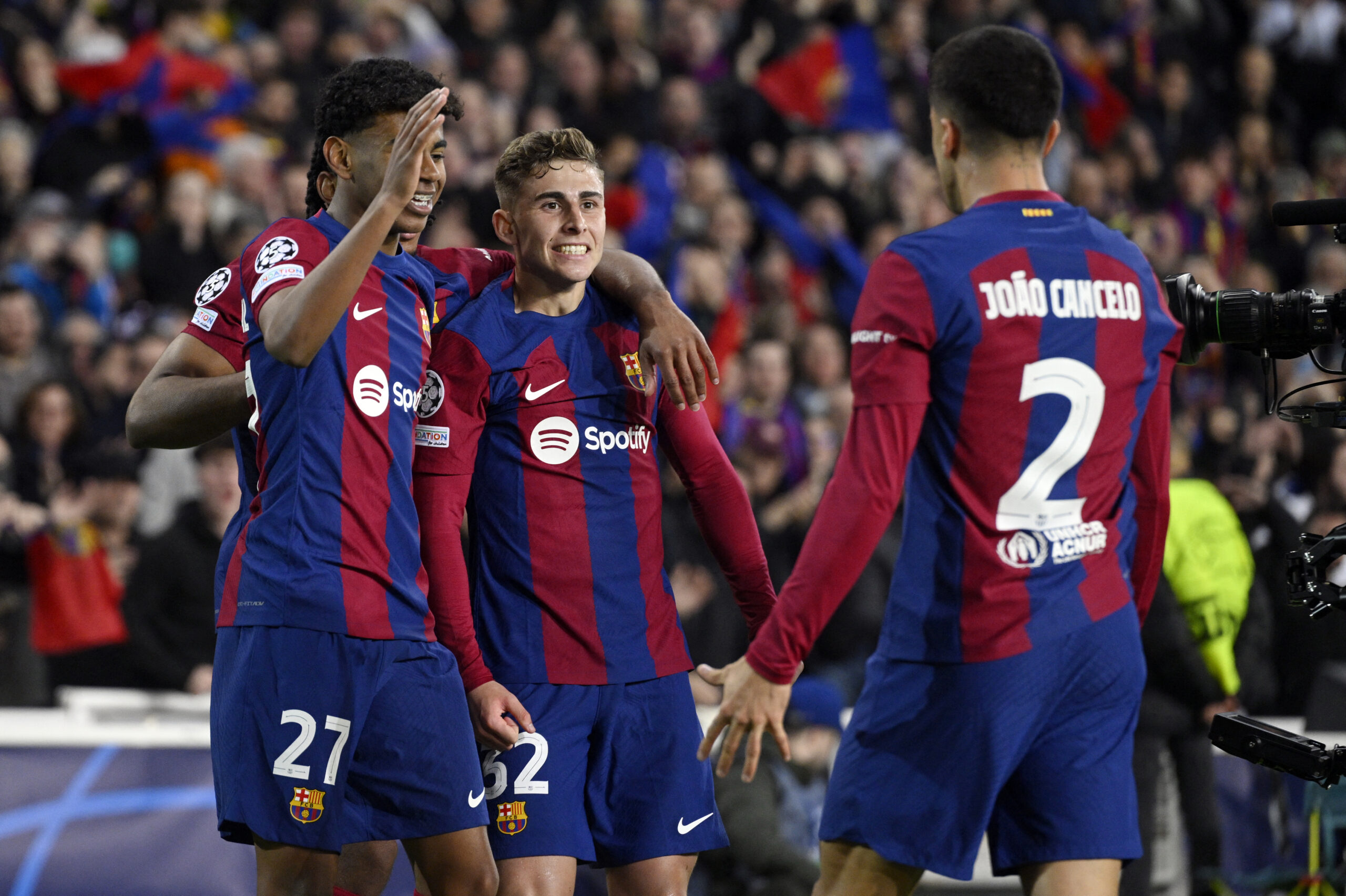 Barcelona's Spanish midfielder #32 Fermin Lopez celebrates scoring the opening goal during the UEFA Champions League last 16 second leg football match between FC Barcelona and SSC Napoli at the Estadi Olimpic Lluis Companys in Barcelona on March 12, 2024.