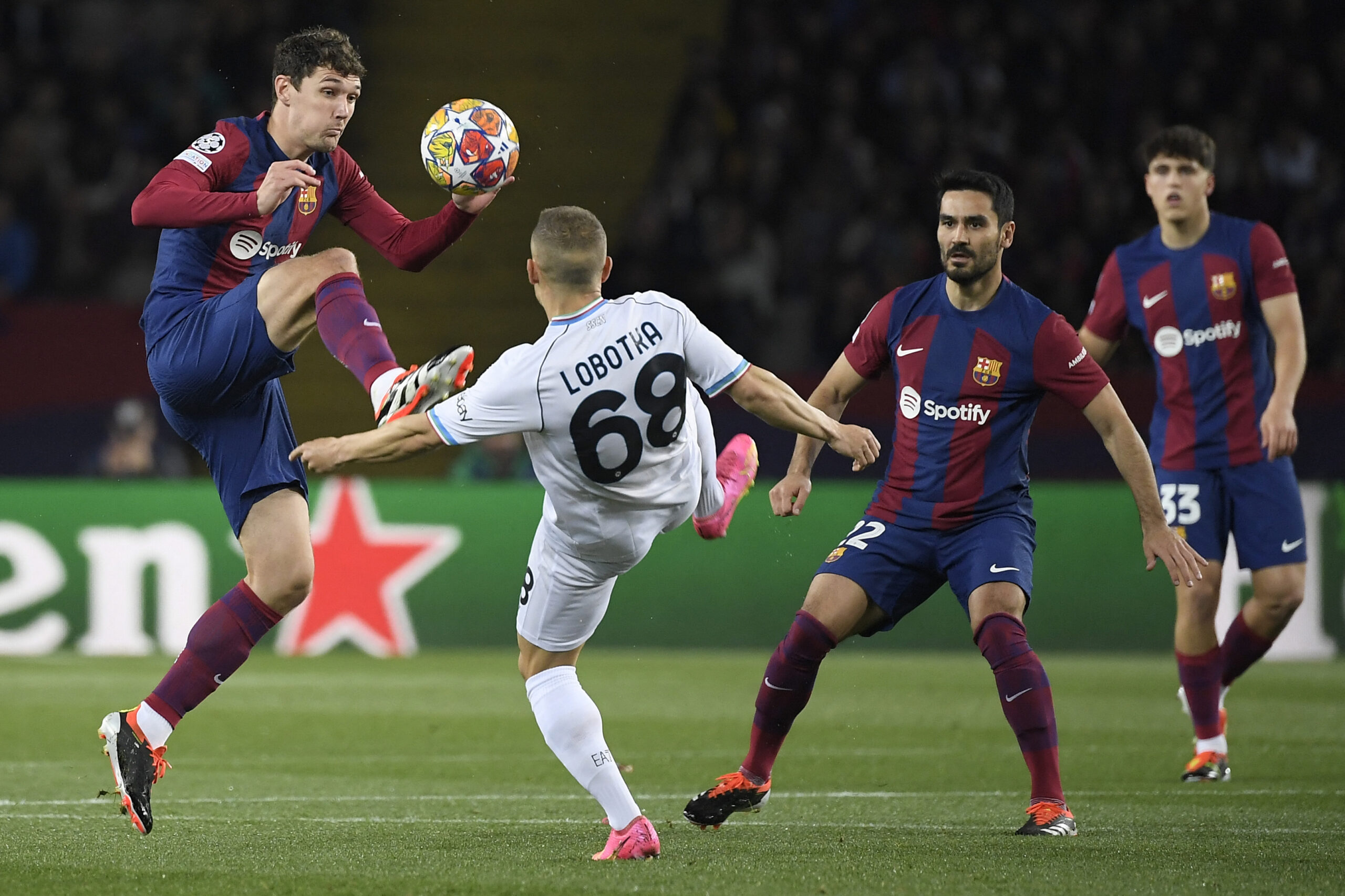 Barcelona's Danish defender #15 Andreas Christensen (L) and Napoli's Slovak midfielder #68 Stanislav Lobotka vie for the ball during the UEFA Champions League last 16 second leg football match between FC Barcelona and SSC Napoli at the Estadi Olimpic Lluis Companys in Barcelona on March 12, 2024.