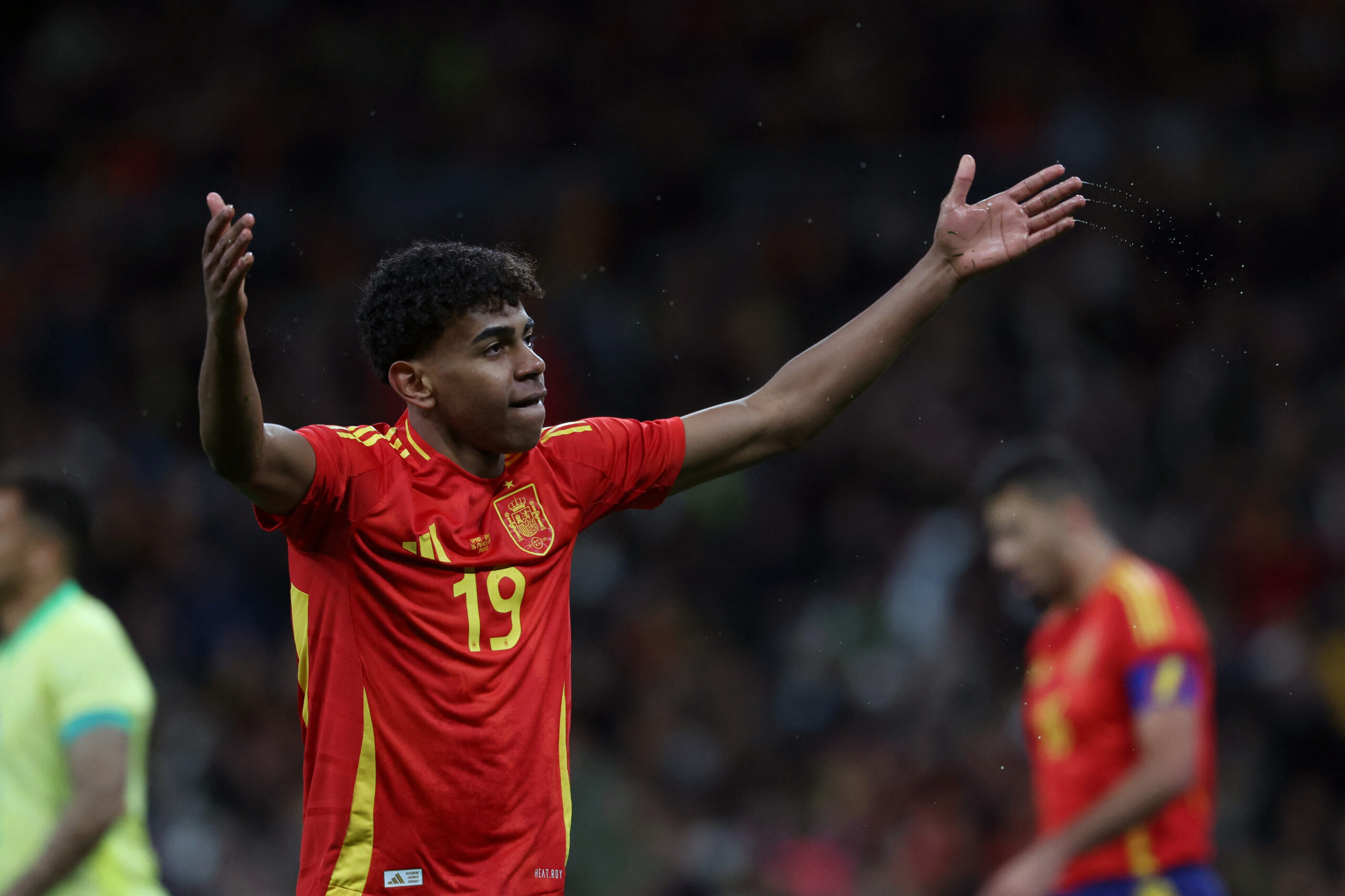 Spain's forward #19 Lamine Yamal reacts during the international friendly football match between Spain and Brazil at the Santiago Bernabeu stadium in Madrid, on March 26, 2024. Spain arranged a friendly against Brazil at the Santiago Bernabeu under the slogan 