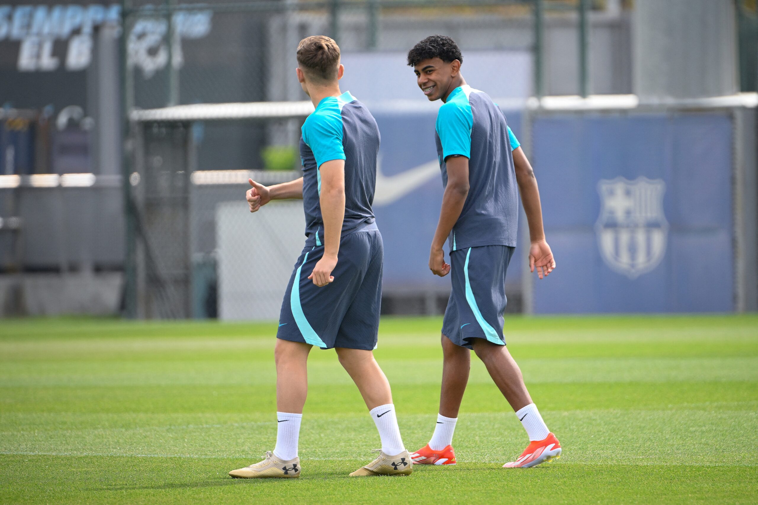 Barcelona's Spanish forward #27 Lamine Yamal (R) attends a training session on the eve of their UEFA Champions League quarter-final second leg football match against Paris SG at the training center in Barcelona on April 15, 2024.