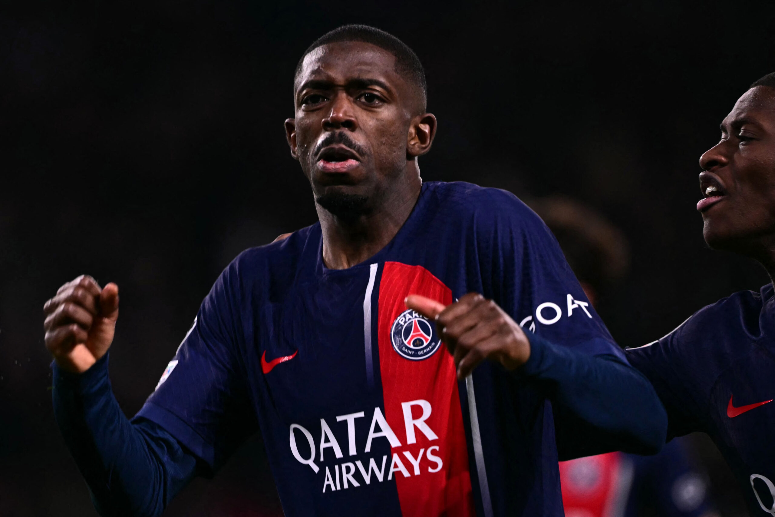 Paris Saint-Germain's French forward #10 Ousmane Dembele celebrates after scoring an equalizer during the UEFA Champions League quarter final first leg football match between Paris Saint-Germain (PSG) and FC Barcelona at the Parc des Princes stadium in Paris on April 10, 2024.
