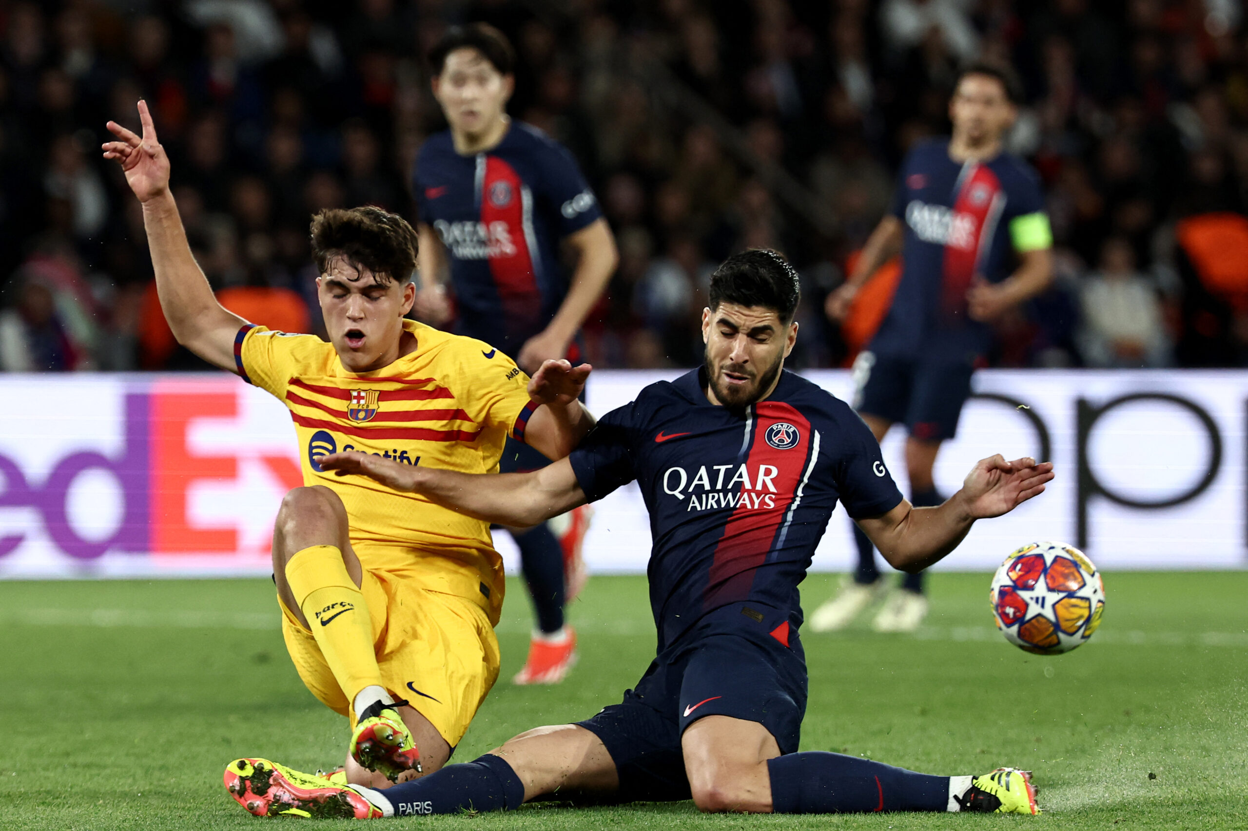 Barcelona defender #33 Pau Cubarsi (L) and Paris Saint-Germain's Brazilian defender #35 Lucas Beraldo fight for the ball during the UEFA Champions League quarter final first leg football match between Paris Saint-Germain (PSG) and FC Barcelona at the Parc des Princes stadium in Paris on April 10, 2024.