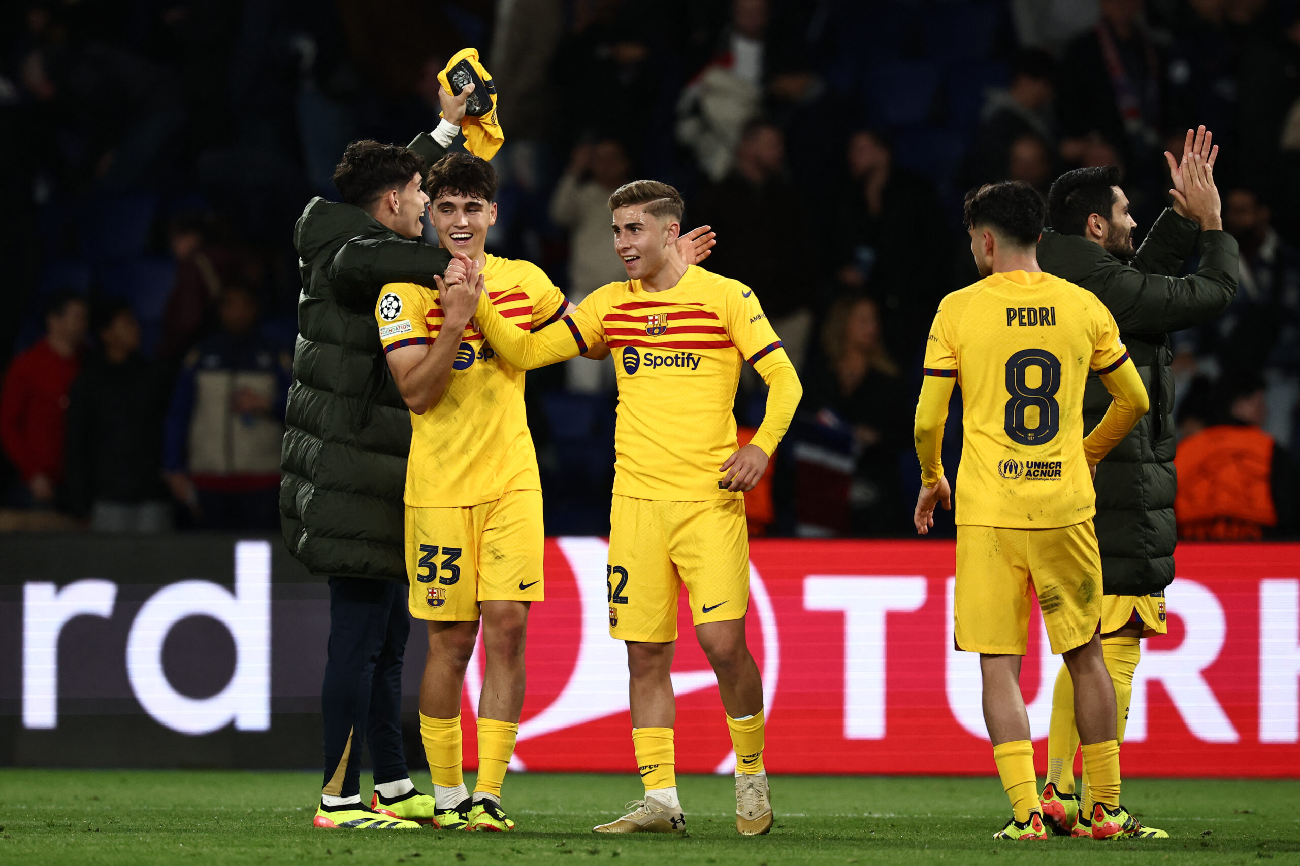 Barcelona defender #33 Pau Cubarsi (2L) and Barcelona's Spanish midfielder #32 Fermin Lopez (C) celebrate Barcelona's win at the end of their UEFA Champions League quarter final first leg football match against Paris Saint-Germain (PSG) at the Parc des Princes stadium in Paris on April 10, 2024.