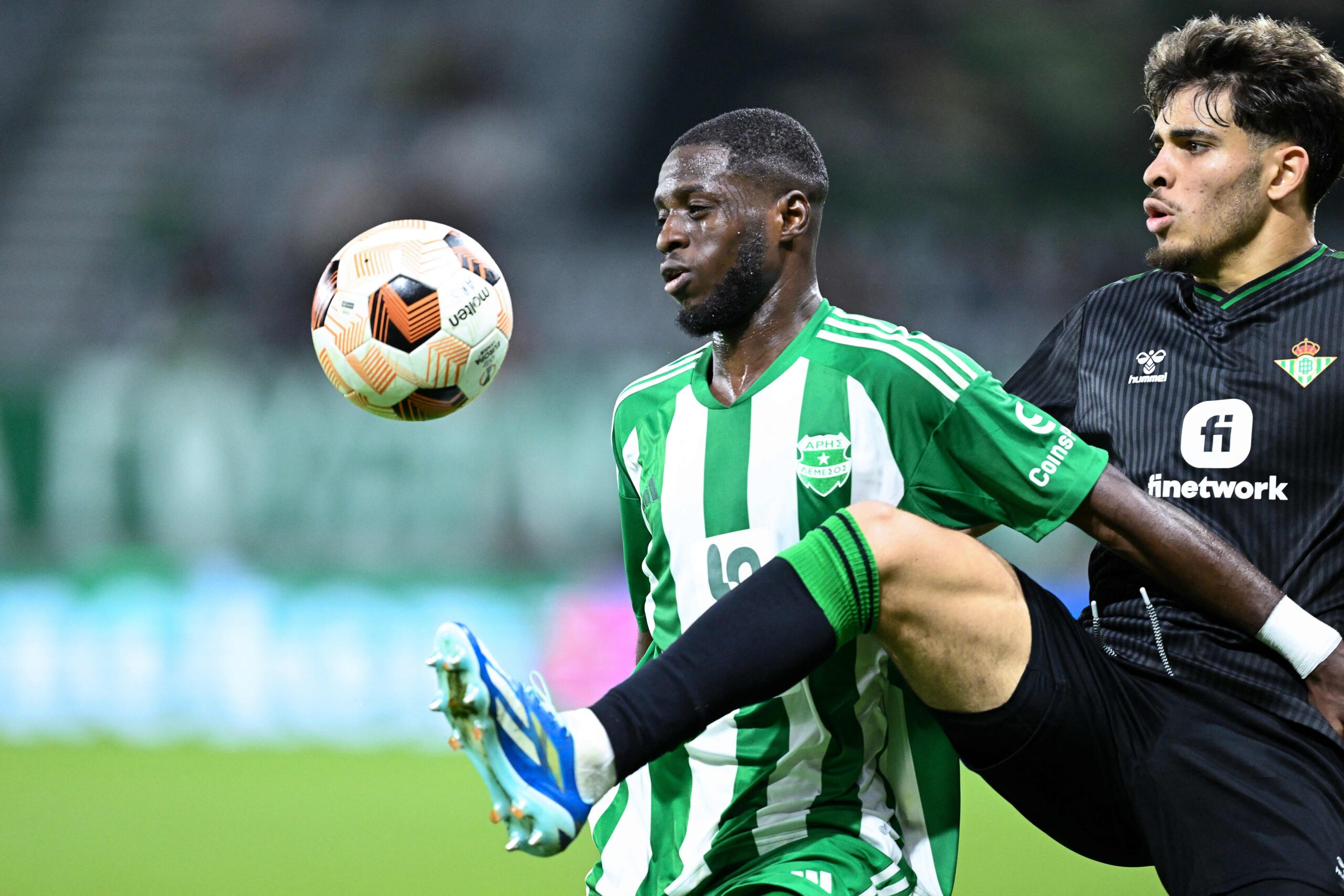 Aris Limassol's Gabonese defender #05 Alex Moucketou-Moussounda (L) fights for the ball with Real Betis' Moroccan striker #07 Ez Abde during the UEFA Europa League Group C football match between Cyprus' Aris Limassol and Spain's Real Betis at the Limassol Stadium on October 26, 2023 in Limassol.