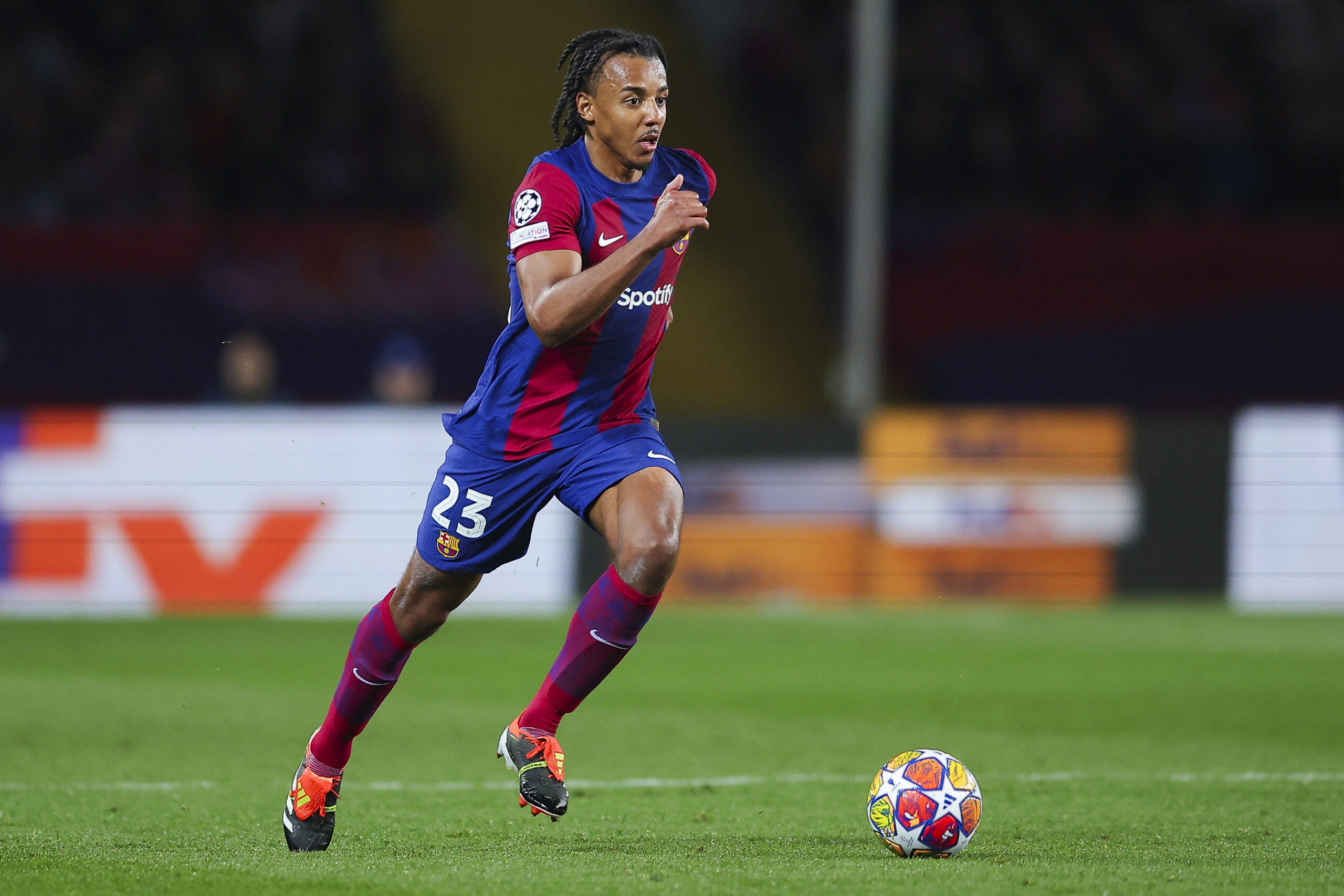 BARCELONA, SPAIN - MARCH 12: Jules Kounde of FC Barcelona run with the ball during the UEFA Champions League 2023/24 round of 16 second leg match between FC Barcelona and SSC Napoli at Estadi Olimpic Lluis Companys on March 12, 2024 in Barcelona, Spain.