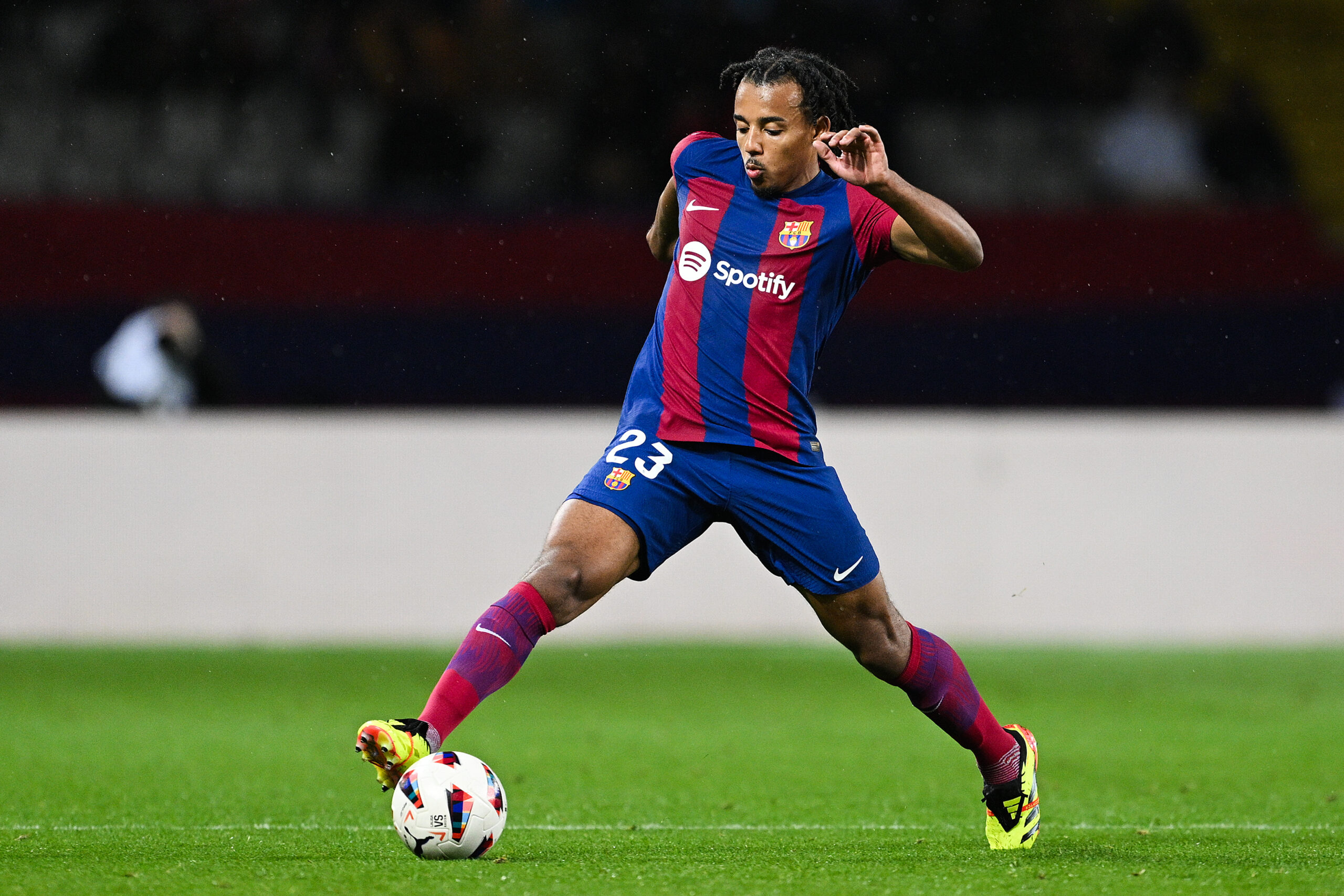 BARCELONA, SPAIN - MARCH 30: Jules Kounde of FC Barcelona runs with the ball during the LaLiga EA Sports match between FC Barcelona and UD Las Palmas at Estadi Olimpic Lluis Companys on March 30, 2024 in Barcelona, Spain.