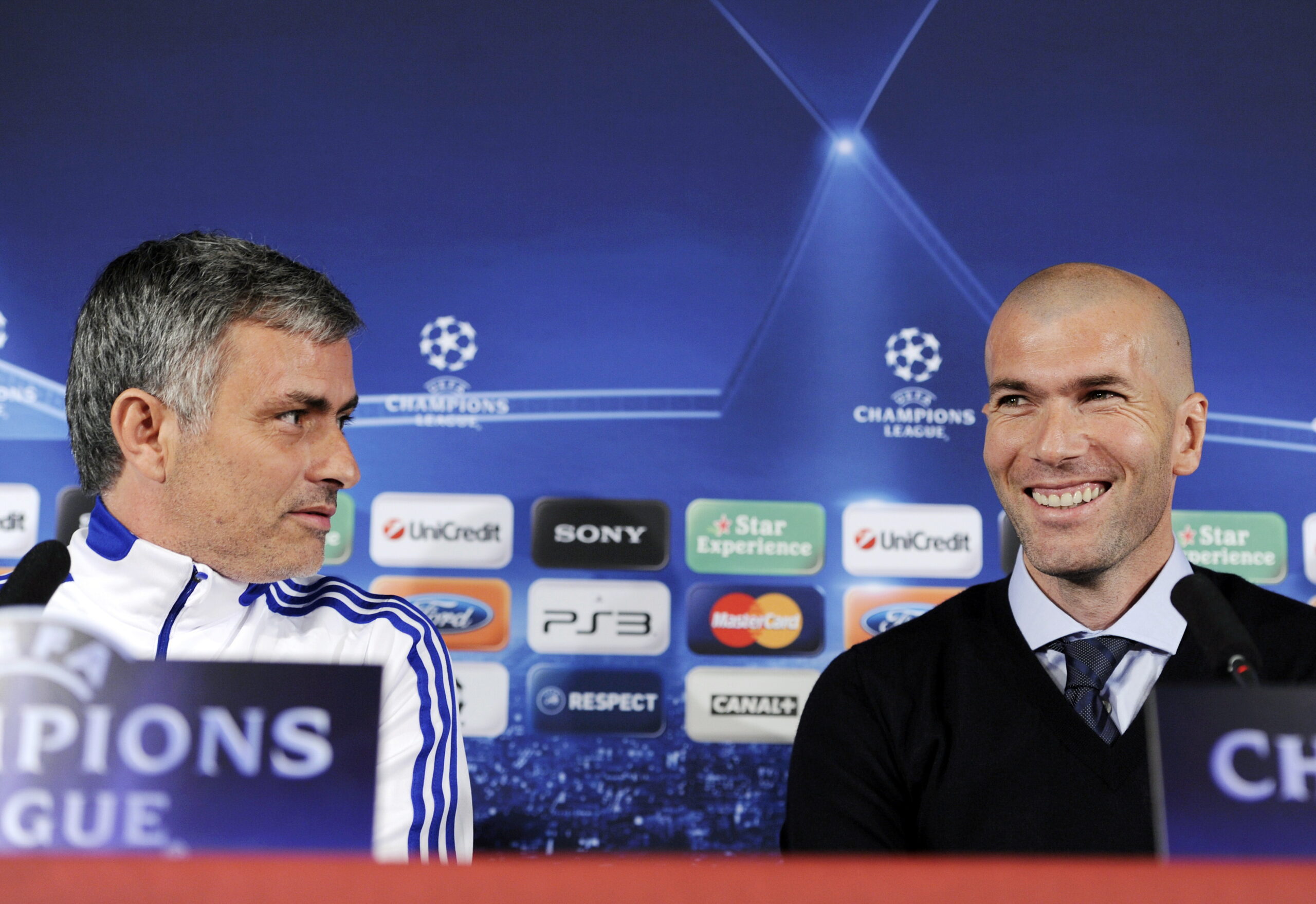 (FILES) This file picture dated February 21, 2011 shows former French football player Zinedine Zidane smiling next to Real Madrid's Portuguese coach Jose Mourinho (L) during a press conference on the eve of UEFA Champions league football match Lyon versus Real Madrid on at the Gerland stadium in Lyon. Zidane annnced on July 7, 2011 that he has been named as Real Madrid's new sporting director for next season.