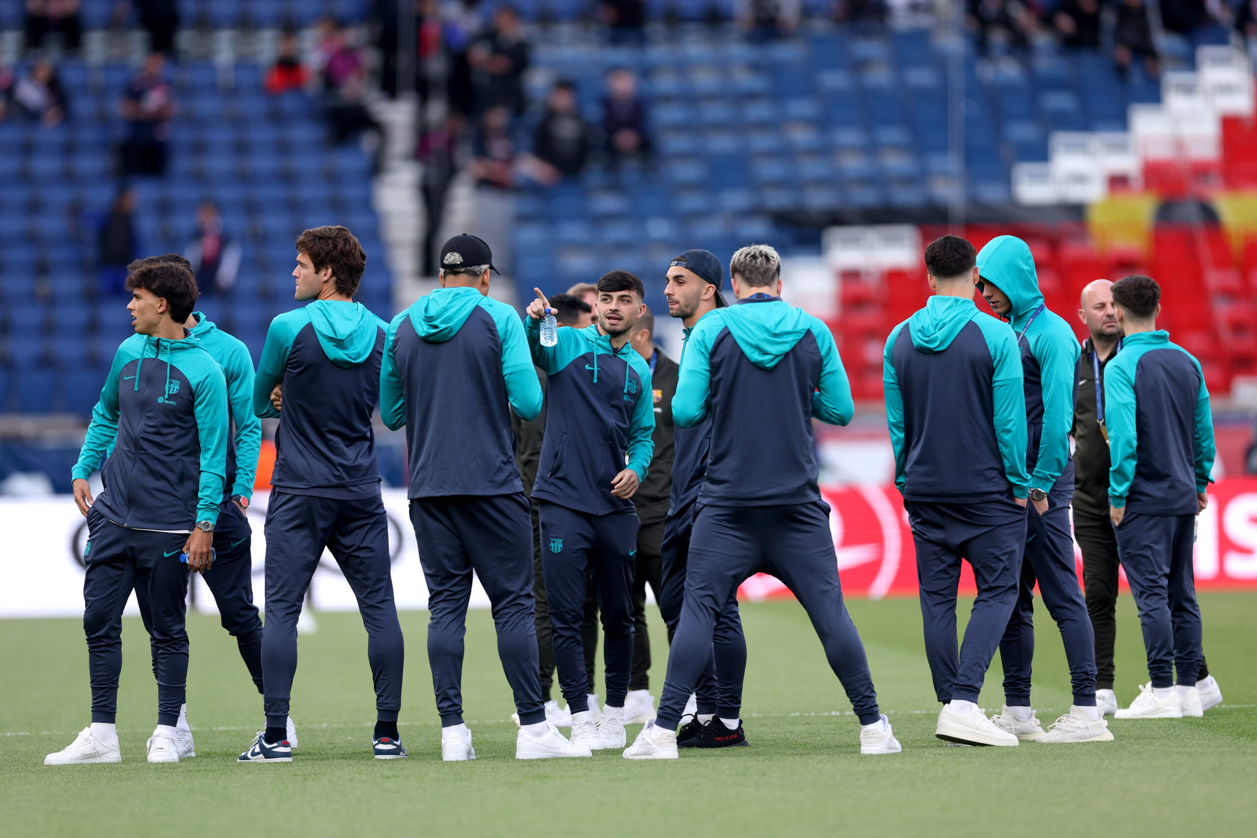 PARIS, FRANCE - APRIL 10: Pedri of FC Barcelona speaks to teammate Ferran Torres on the pitch prior to the UEFA Champions League quarter-final first leg match between Paris Saint-Germain and FC Barcelona at Parc des Princes on April 10, 2024 in Paris, France.