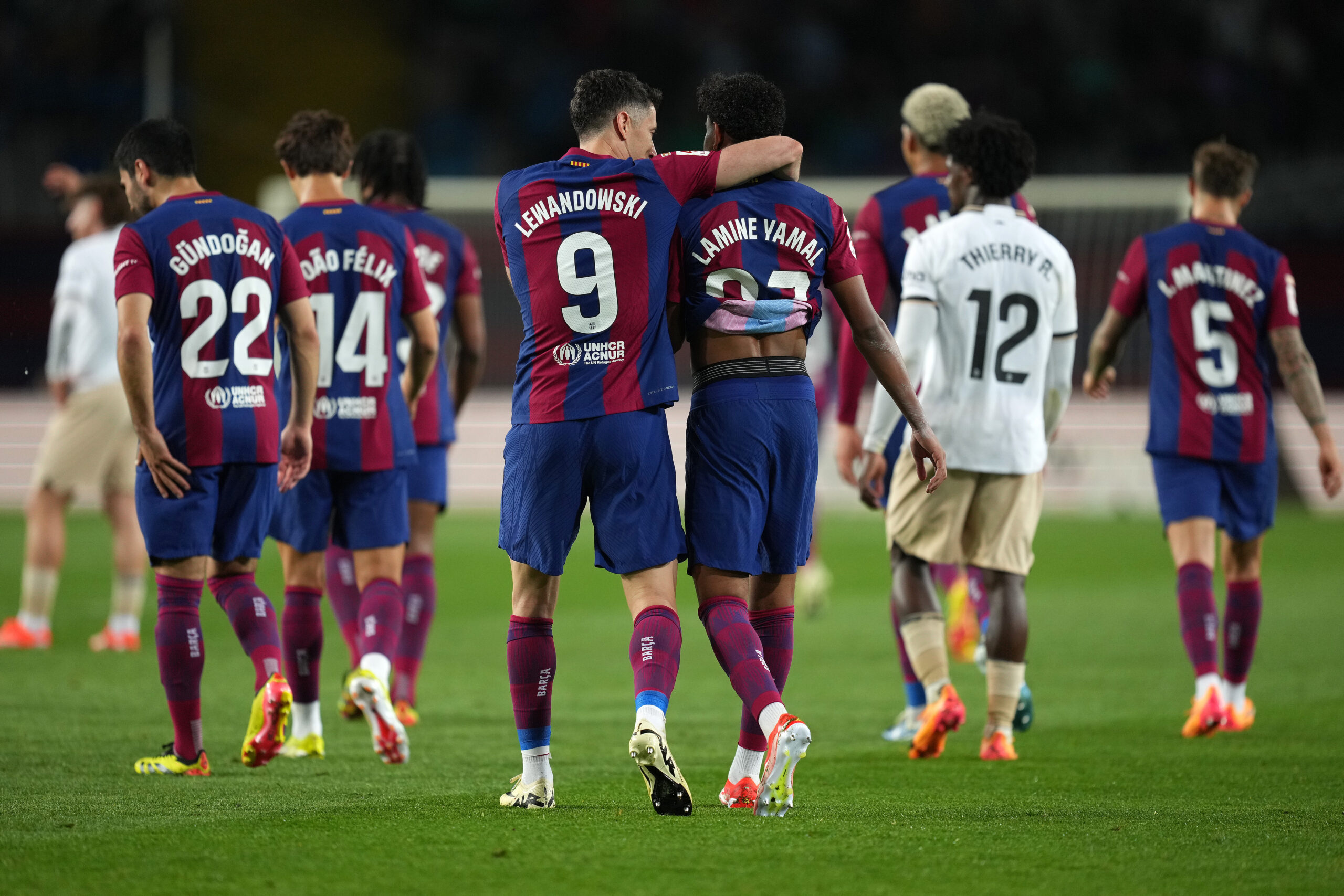 BARCELONA, SPAIN - APRIL 29: Robert Lewandowski of FC Barcelona celebrates with Lamine Yamal of FC Barcelona after scoring his team's fourth goal to compete his hat-trick during the LaLiga EA Sports match between FC Barcelona and Valencia CF at Estadi Olimpic Lluis Companys on April 29, 2024 in Barcelona, Spain.