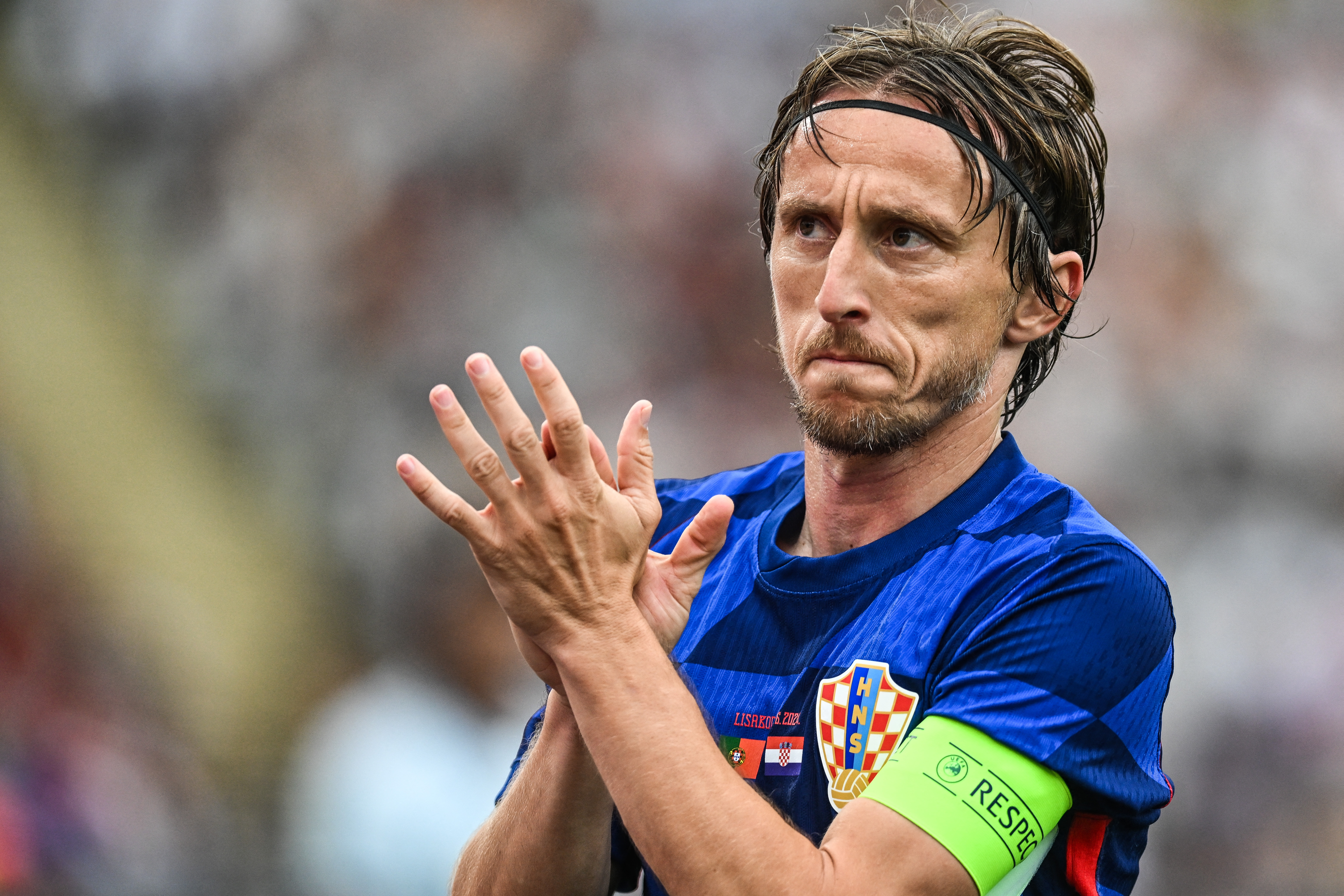 Croatia's midfielder #10 Luka Modric applauds during the international friendly football match between Portugal and Croatia at Jamor stadium in Oeiras on June 8, 2024.