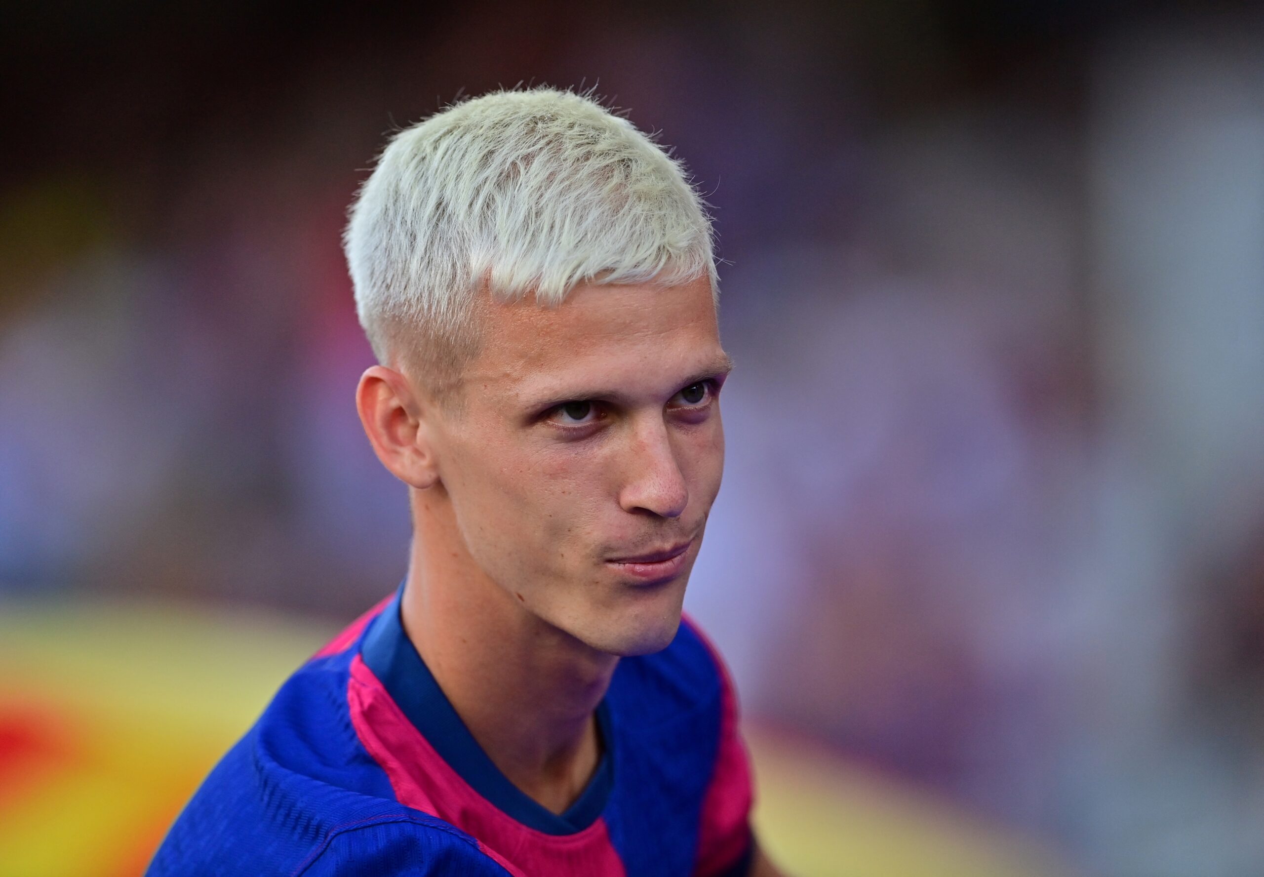 Barcelona's Spanish midfielder #20 Dani Olmo looks on during his presentation prior the 59th Joan Gamper Trophy football match between FC Barcelona and AS Monaco at the Estadi Olimpic Lluis Companys in Barcelona on August 12, 2024.