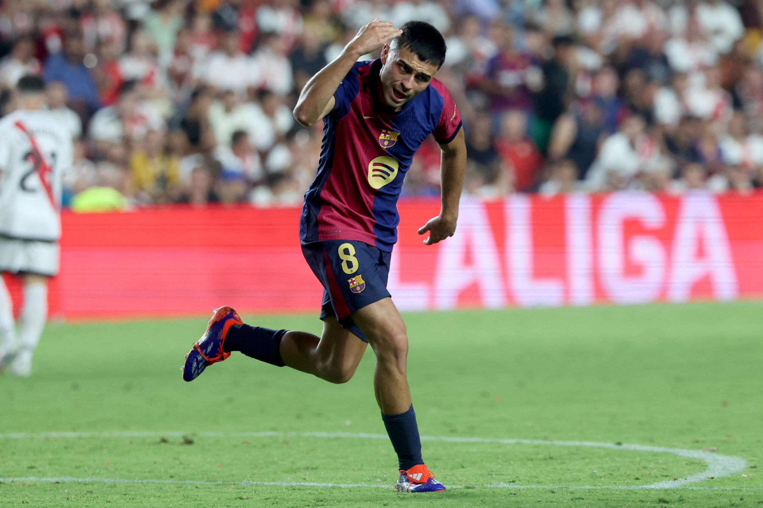 Barcelona's Spanish midfielder #08 Pedri celebrates scoring his team's first goal during the Spanish league football match between Rayo Vallecano de Madrid and FC Barcelona on August 27, 2024.