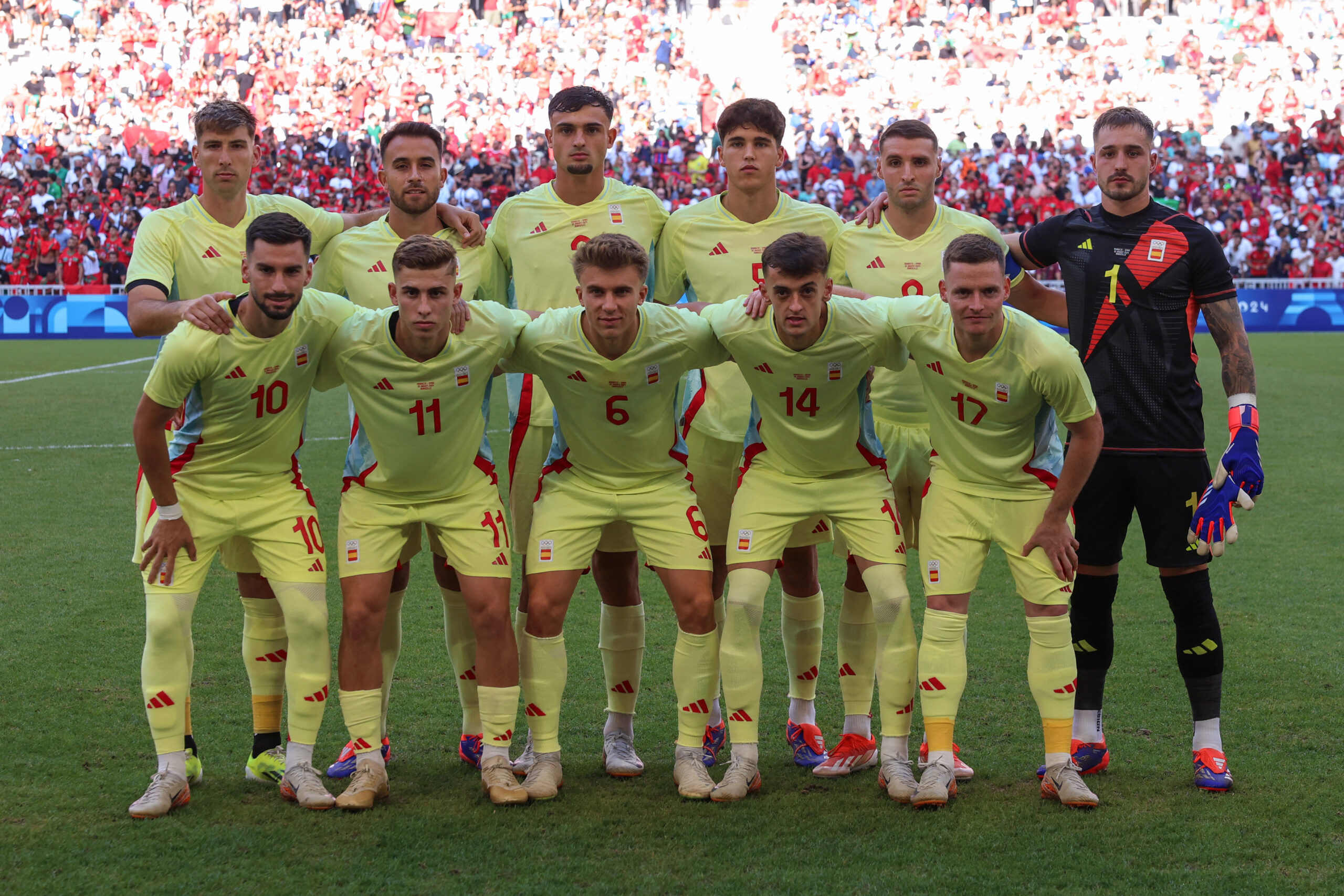 (From back row left) Spain's players, Spain's defender #03 Juan Miranda, Spain's defender #04 Eric Garcia, Spain's defender #02 Marc Pubill, Spain's defender #05 Pau Cubarsi, Spain's forward #09 Abel Ruiz, Spain's goalkeeper #01 Arnau Tenas, Spain's midfielder #10 Alex Baena, Spain's midfielder #11 Fermin Lopez, Spain's midfielder #06 Pablo Barrios, Spain's midfielder #14 Aimar Oroz and Spain's defender #17 Sergio Gomez pose before the men's semi-final football match between Morocco and Spain of the Paris 2024 Olympic Games at the Marseille Stadium in Marseille on August 5, 2024.