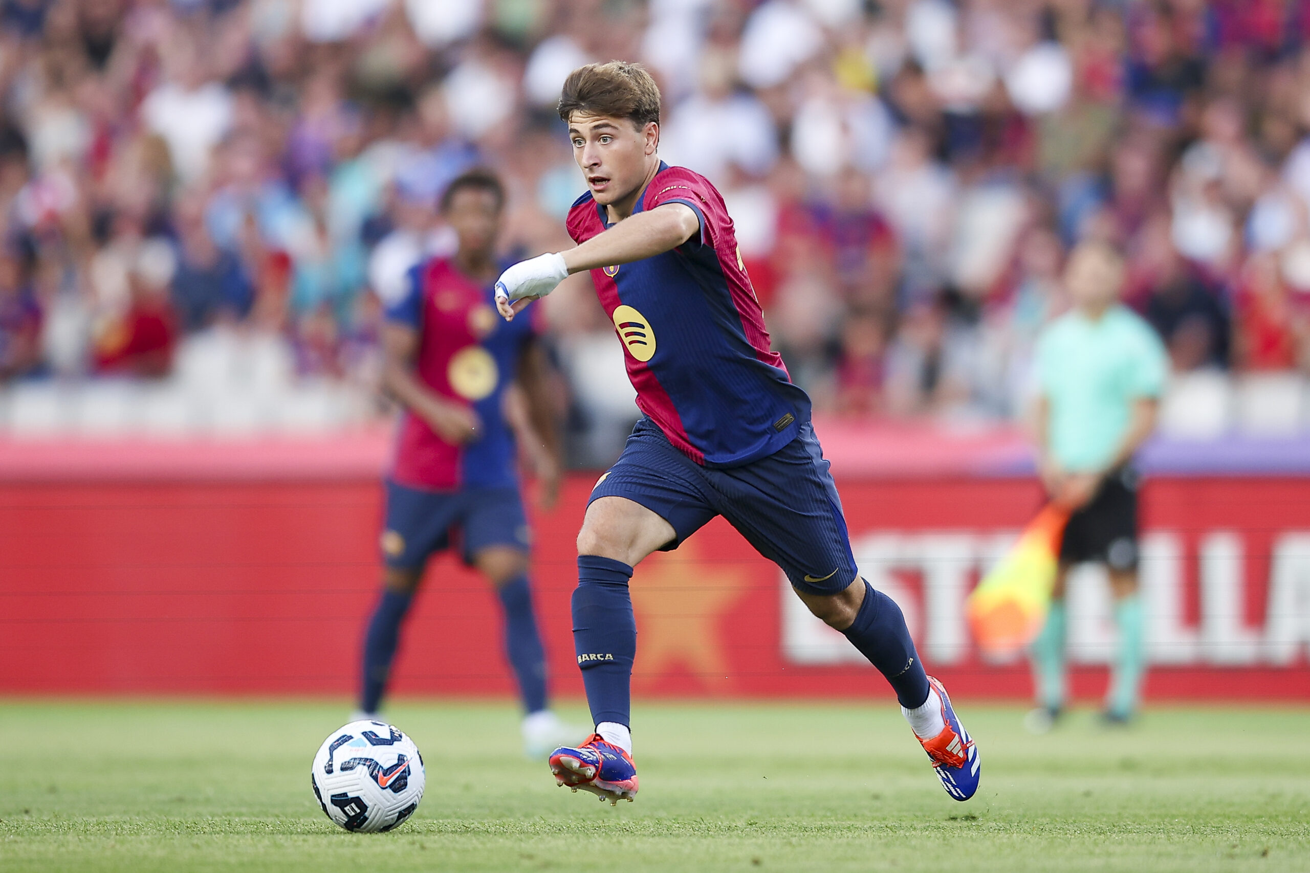 BARCELONA, SPAIN - AUGUST 12: Pablo Torre of FC Barcelona run with the ball during the Joan Gamper Trophy match between FC Barcelona and AS Monaco at Estadi Olimpic Lluis Companys on August 12, 2024 in Barcelona, Spain.