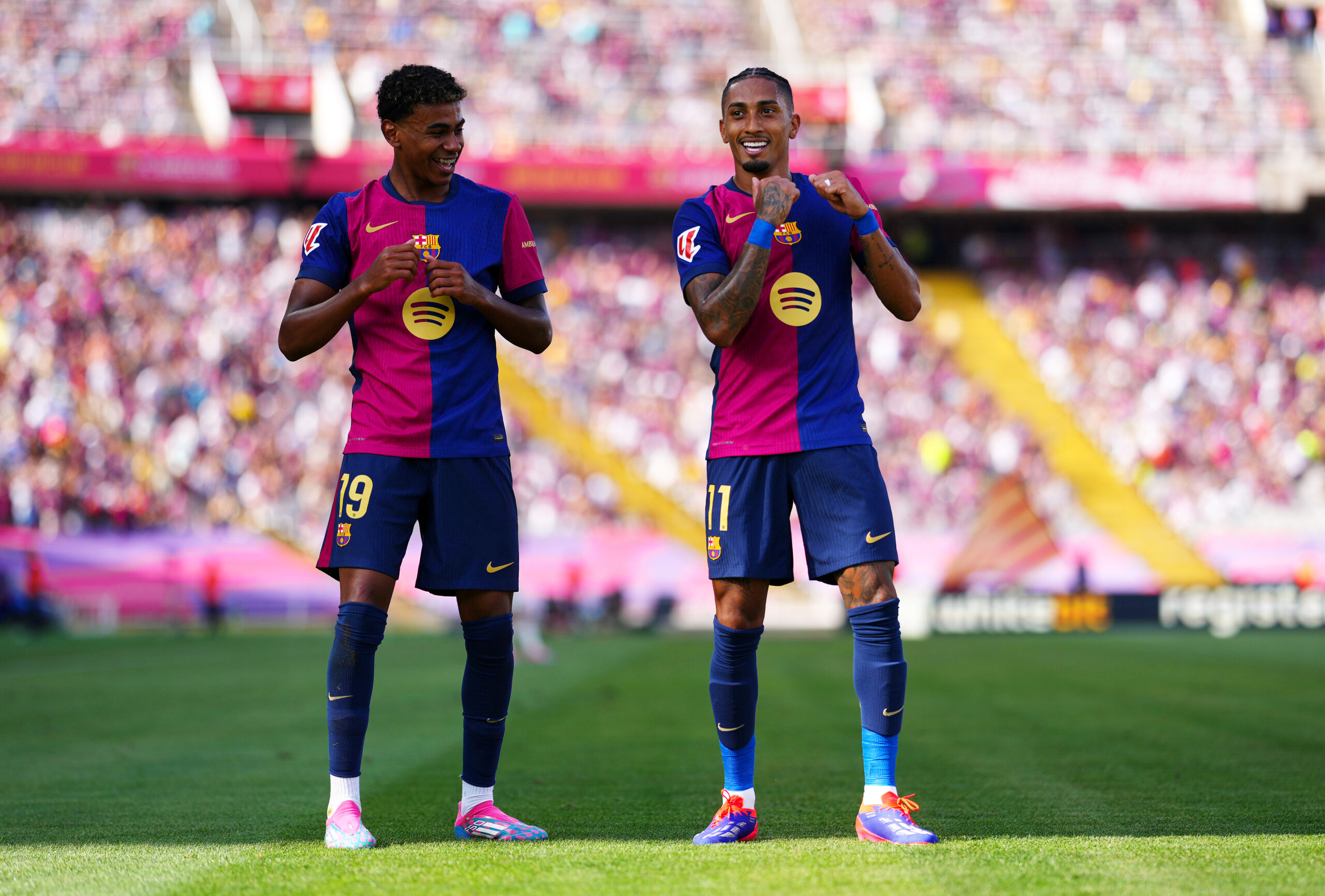BARCELONA, SPAIN - AUGUST 31: Raphinha of FC Barcelona celebrates scoring his team's first goal with team mate Lamine Yamal during the La Liga match between FC Barcelona and Real Valladolid CF at Camp Nou on August 31, 2024 in Barcelona, Spain.
