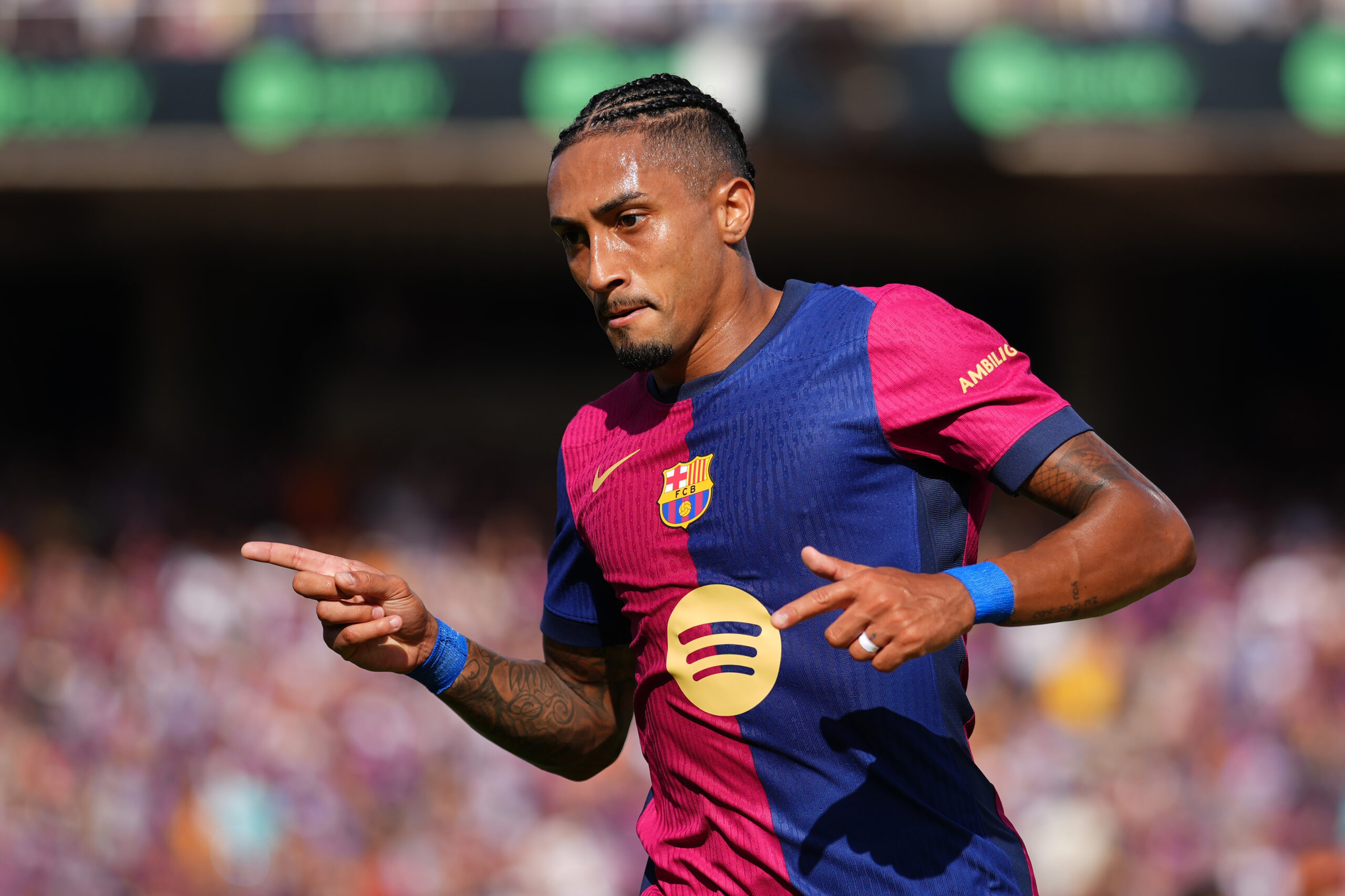 BARCELONA, SPAIN - AUGUST 31: Raphinha of FC Barcelona celebrates scoring his team's first goal during the La Liga match between FC Barcelona and Real Valladolid CF at Camp Nou on August 31, 2024 in Barcelona, Spain.