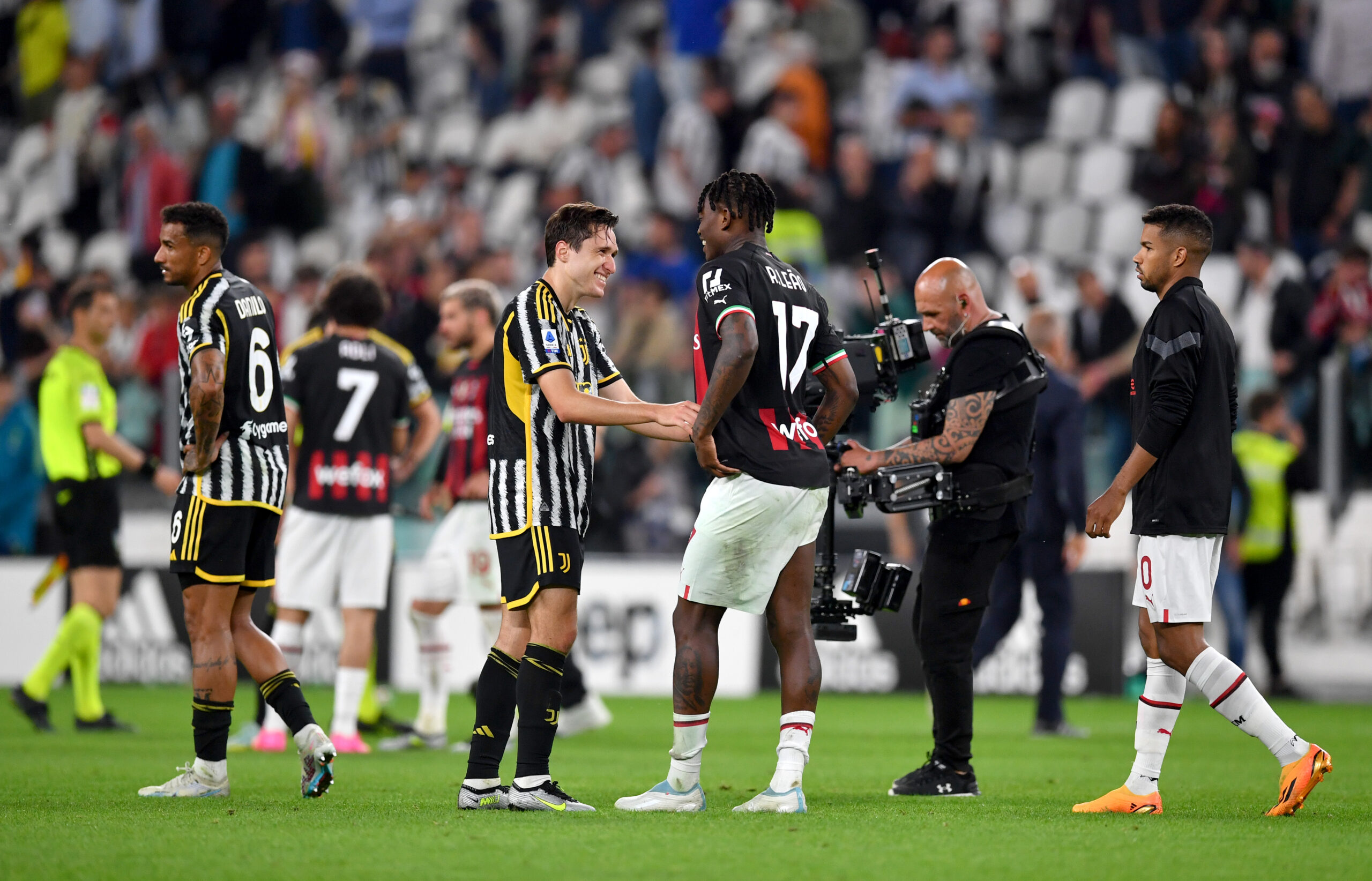 TURIN, ITALY - MAY 28: Federico Chiesa of Juventus and Rafael Leao of AC Milan talk following the Serie A match between Juventus and AC MIlan at Allianz Stadium on May 28, 2023 in Turin, Italy.