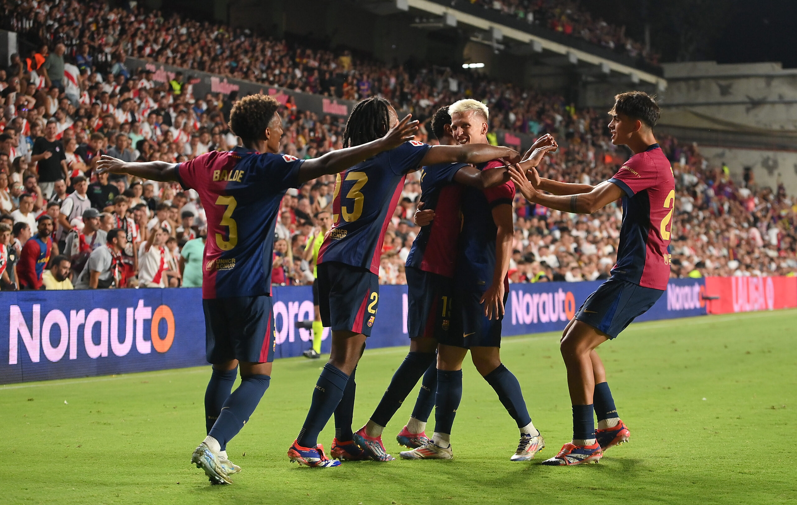 MADRID, SPAIN - AUGUST 27: Dani Olmo of FC Barcelona celebrates with teammates after scorin their second goal during the La Liga match between Rayo Vallecano and FC Barcelona at Estadio de Vallecas on August 27, 2024 in Madrid, Spain.