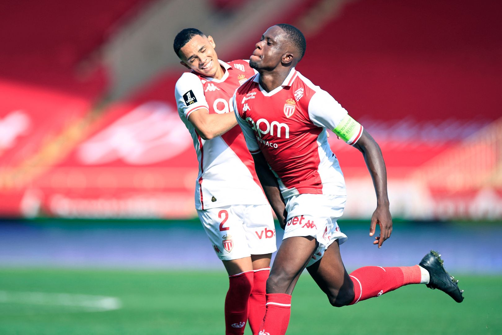 Monaco's Swiss midfielder #06 Denis Zakaria (R) celebrates after scoring a goal during the French L1 football match between AS Monaco and RC Lens at the Louis II Stadium (Stade Louis II) in the Principality of Monaco on September 1, 2024.