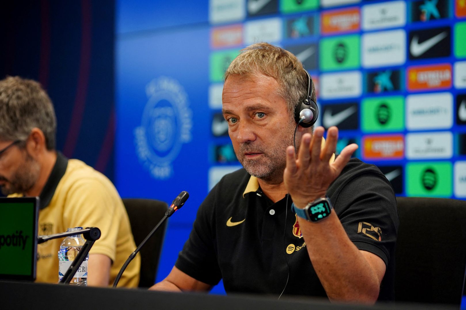 Barcelona's German coach Hansi Flick gestures during a press conference of the Spanish league football match between Valencia CF and FC Barcelona, at the Estadi Olimpic Lluis Companys in Barcelona on August 16, 2024.