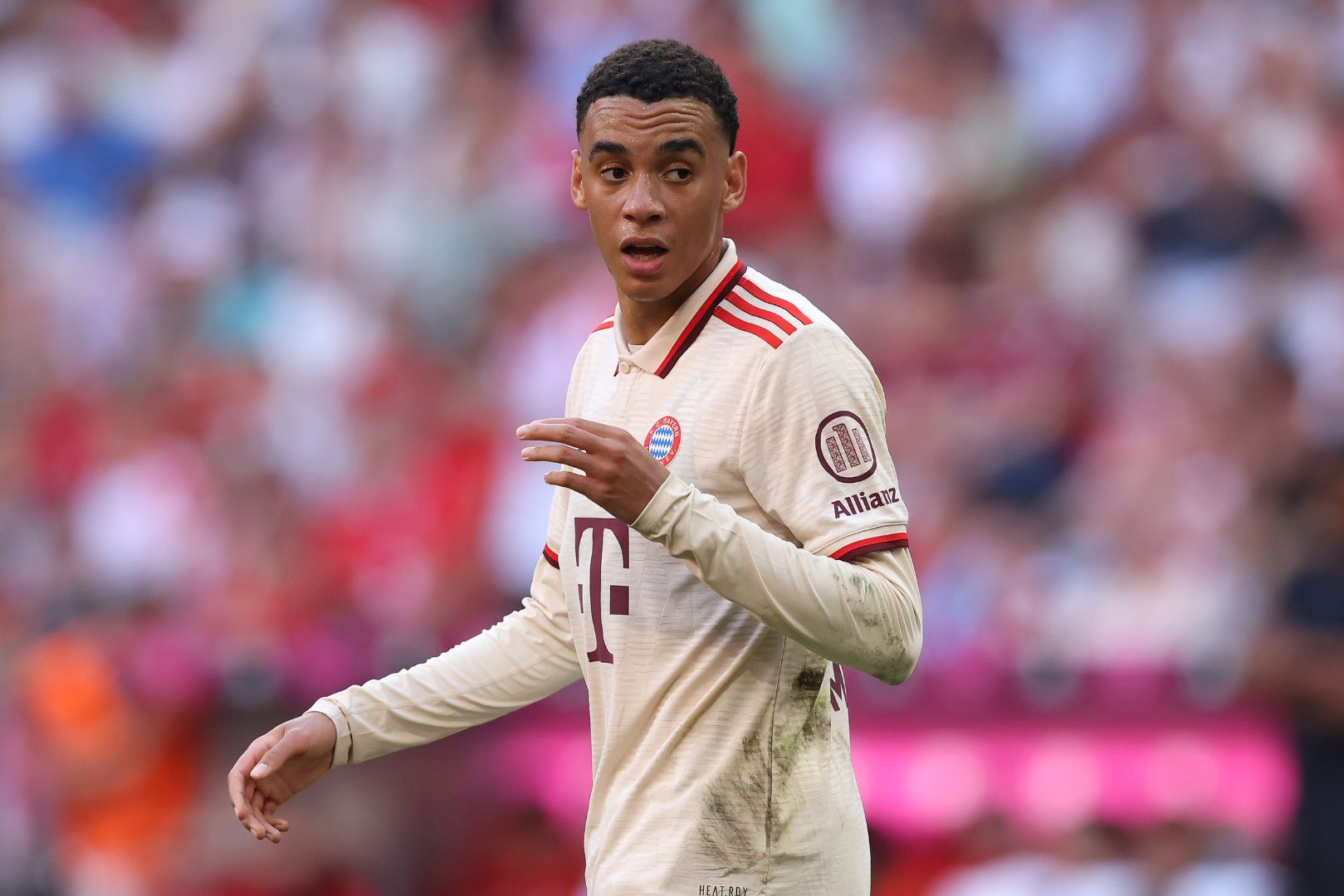 MUNICH, GERMANY - SEPTEMBER 01: Jamal Musiala of FC Bayern München looks on during the Bundesliga match between FC Bayern München and Sport-Club Freiburg at Allianz Arena on September 01, 2024 in Munich, Germany.