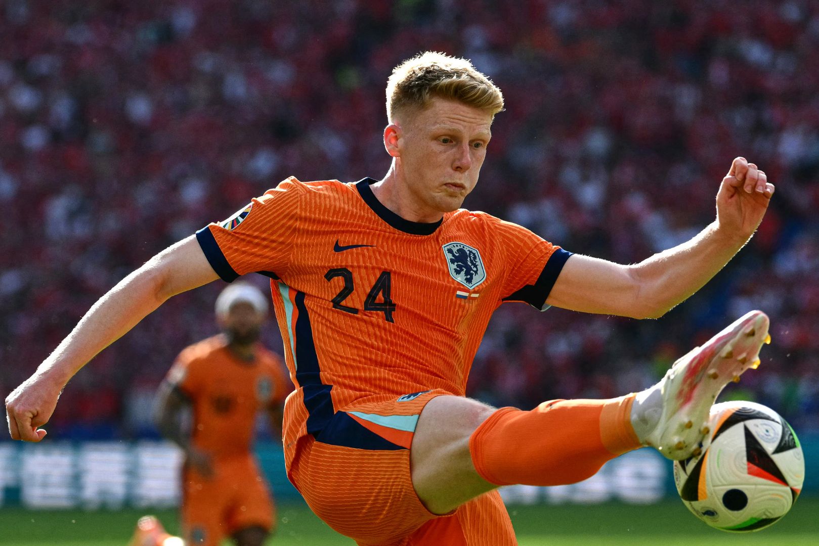 Netherlands' midfielder #24 Jerdy Schouten shoots the ball during the UEFA Euro 2024 Group D football match between the Netherlands and Austria at the Olympiastadion in Berlin on June 25, 2024.