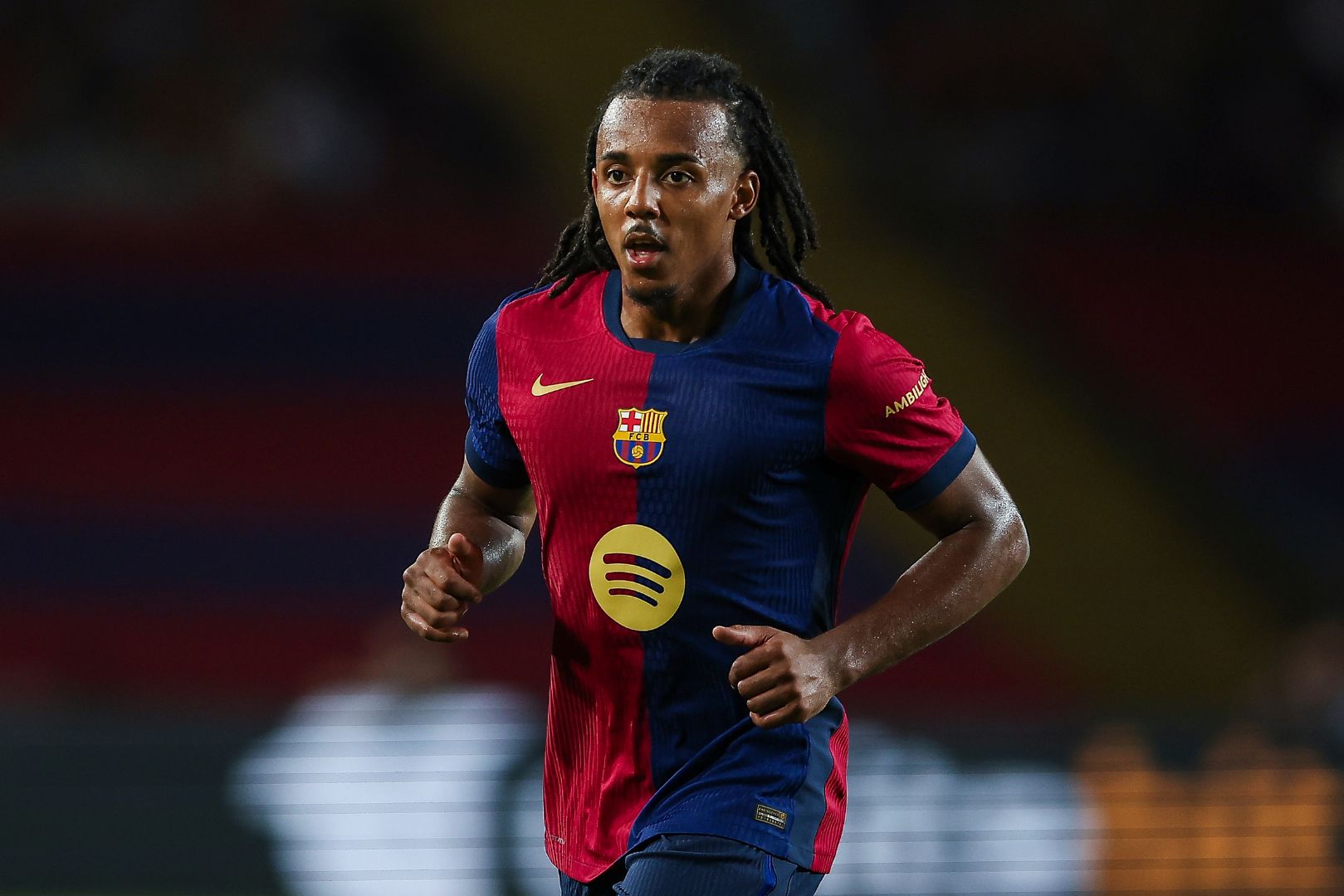 BARCELONA, SPAIN - AUGUST 12: Jules Kounde of FC Barcelona looks on during the Joan Gamper Trophy match between FC Barcelona and AS Monaco at Estadi Olimpic Lluis Companys on August 12, 2024 in Barcelona, Spain