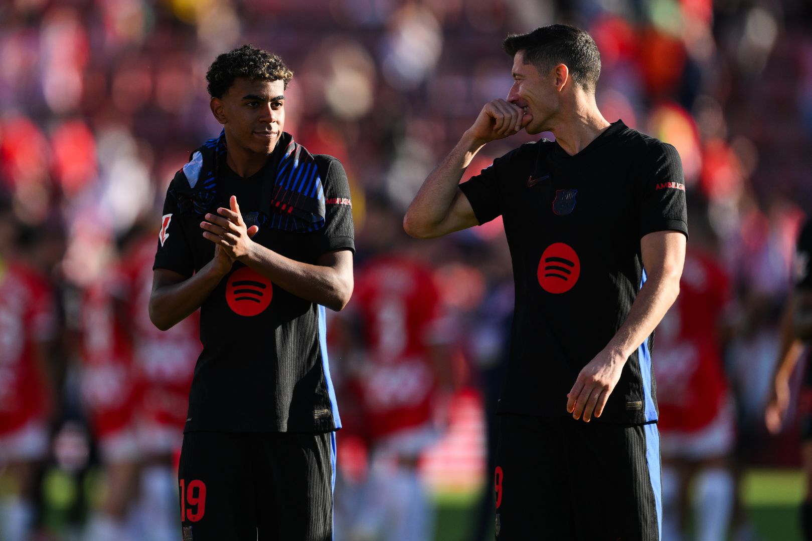 GIRONA, SPAIN - SEPTEMBER 15: Lamine Yamal and Robert Lewandowski of Barcelona FC acknowledge the crowd during the LaLiga match between Girona FC and FC Barcelona at Montilivi Stadium on September 15, 2024 in Girona, Spain.
