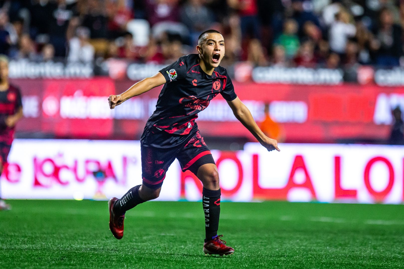TIJUANA, MEXICO - AUGUST 30: 15 year-old Gilberto Mora of Tijuana celebrates after scoring the team's second goal during the 6th round match between Tijuana and Leon as part of the Torneo Apertura 2024 Liga MX at Caliente Stadium on August 30, 2024 in Tijuana, Mexico. With this goal, Mora becomes the youngest player to score a goal in the Mexican league.
