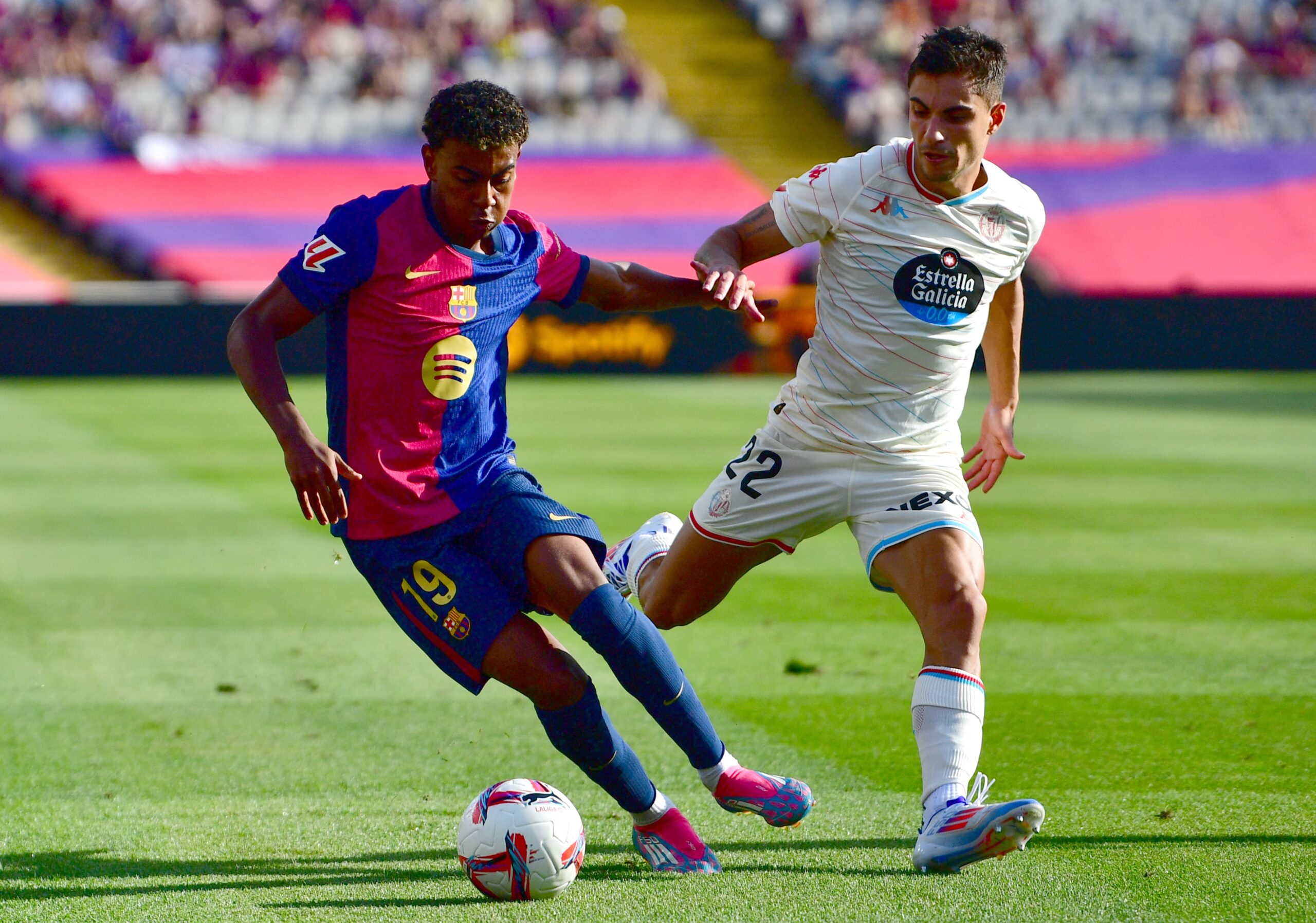 Barcelona's Spanish forward #19 Lamine Yamal fights for the ball with Real Valladolid's Brazilian defender #22 Lucas Rosa during the Spanish league football match between FC Barcelona and Real Valladolid FC at the Estadi Olimpic Lluis Companys in Barcelona on August 31, 2024.