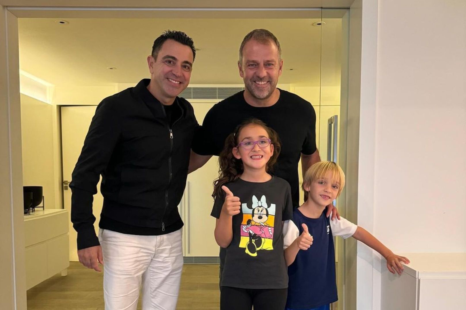 Xavi Hernández with new Barcelona head coach Hansi Flick.
