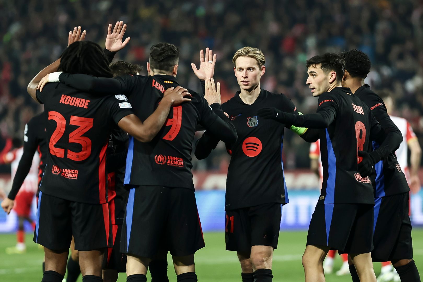 BELGRADE, SERBIA - NOVEMBER 6: Robert Lewandowski (C) of Barcelona celebrates after scoring a goal with Frenkie de Jong (R) and Jules Kounde (L) during the UEFA Champions League 2024/25 League Phase MD4 match between FK Crvena Zvezda and FC Barcelona at Stadium Rajko Mitic on November 6, 2024 in Belgrade, Serbia.